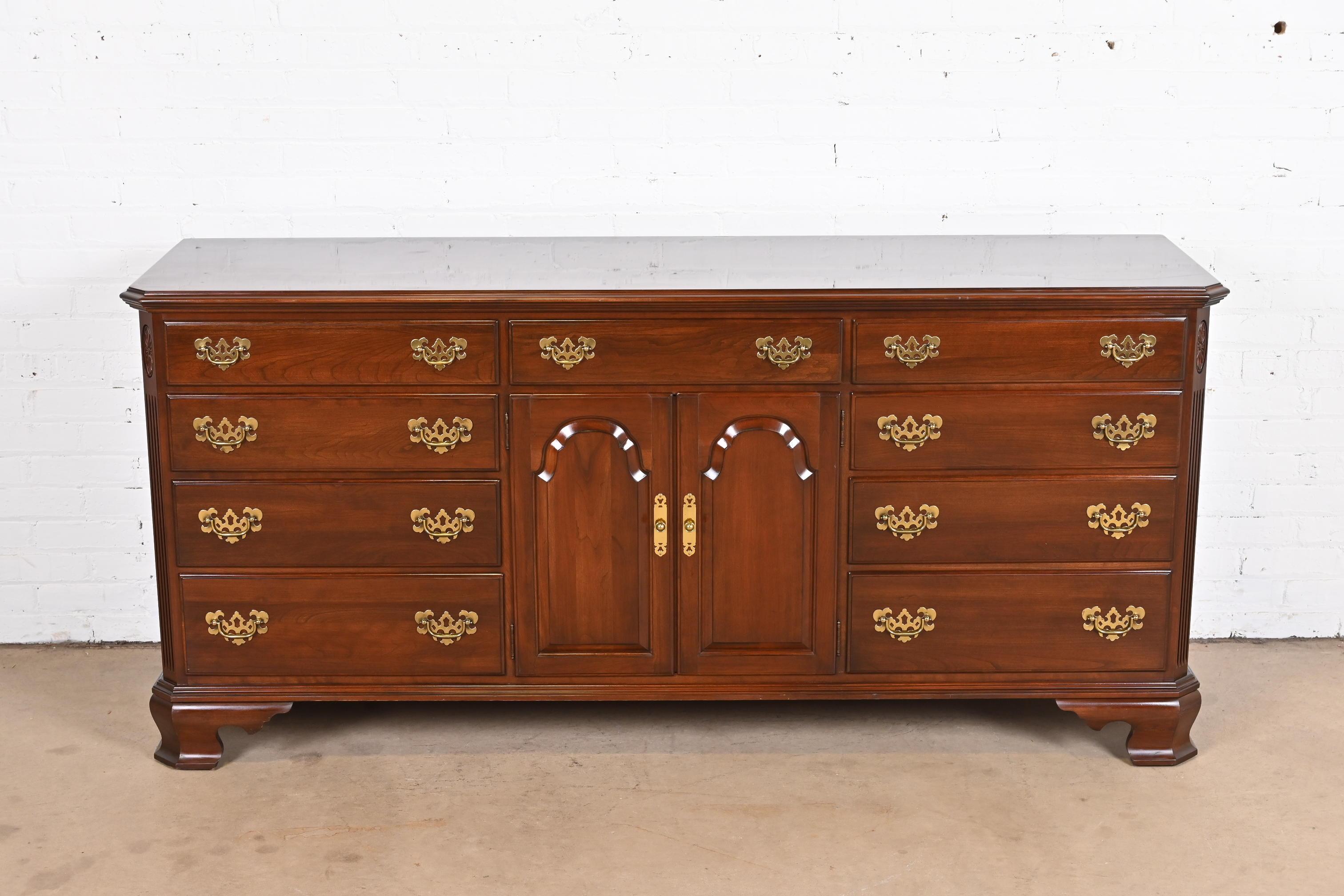 A gorgeous Georgian or Chippendale style eleven-drawer dresser or credenza

By Ethan Allen

USA, Circa 1980s

Carved solid cherry wood, with original brass hardware.

Measures: 74