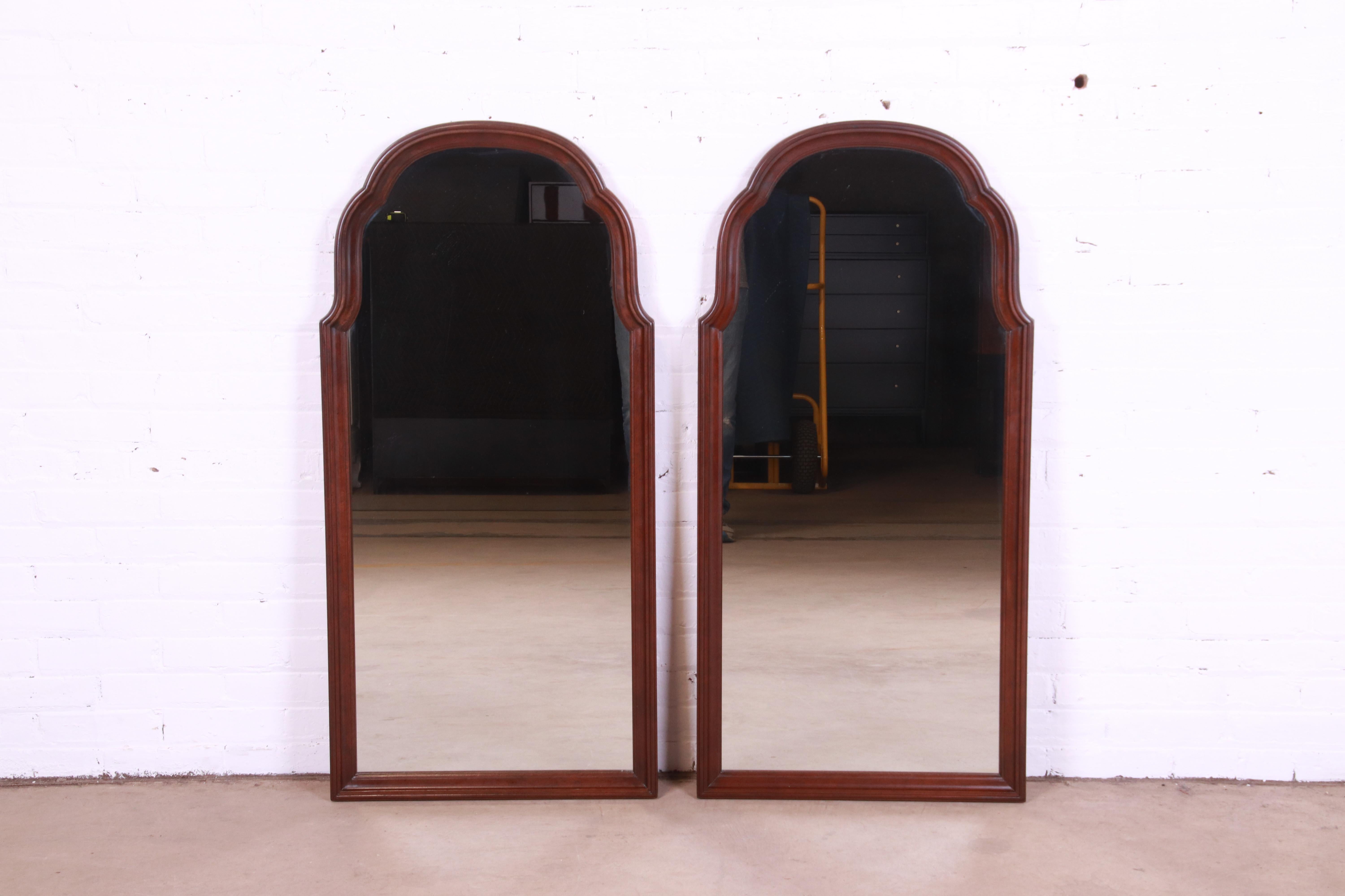 A beautiful pair of tall traditional Georgian style carved cherry wood framed wall mirrors

By Ethan Allen

USA, Circa 1980s

Measures: 22.63