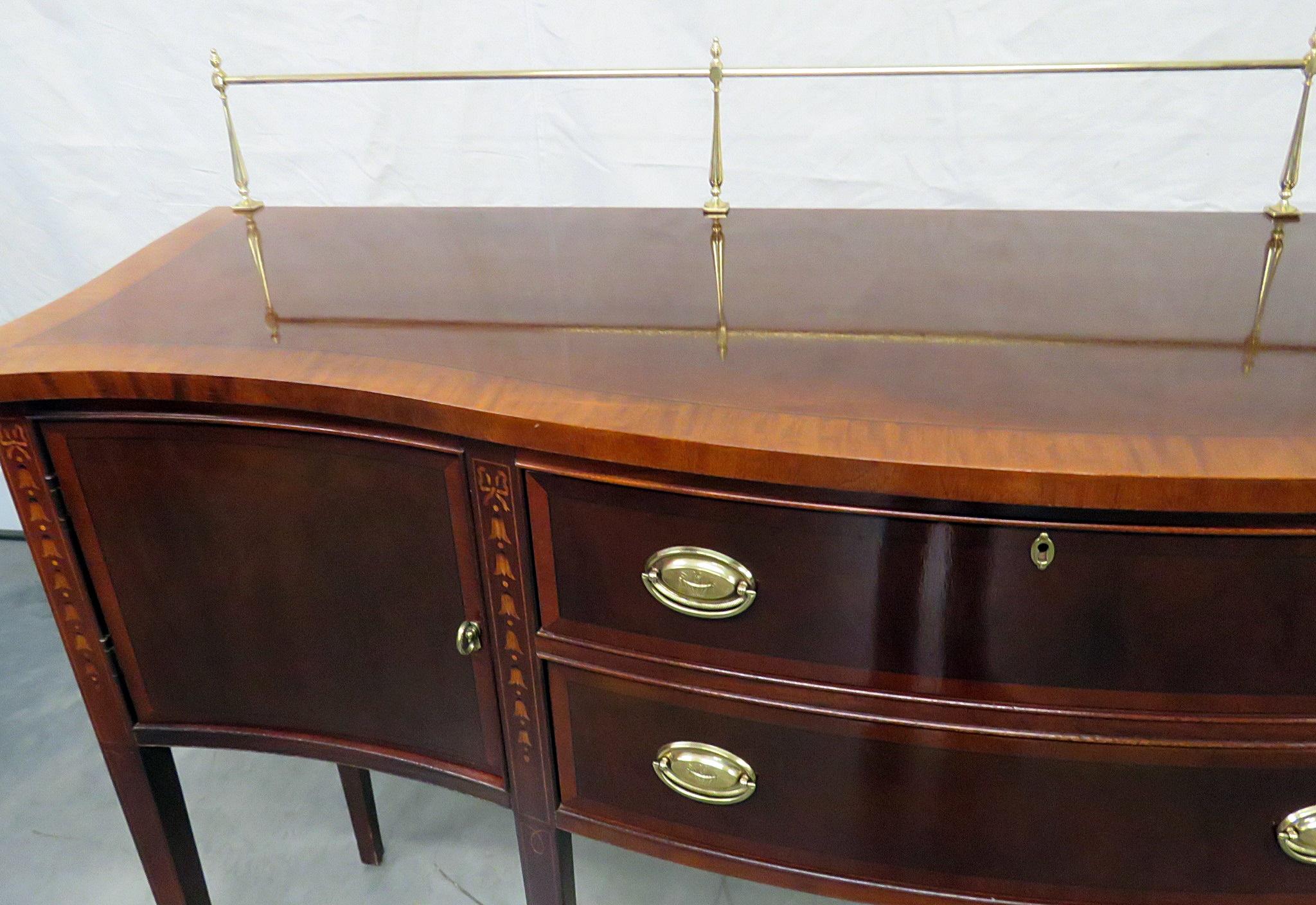 Ethan Allen inlaid Federal style sideboard with 2 doors, 2 drawers, and a brass gallery.
