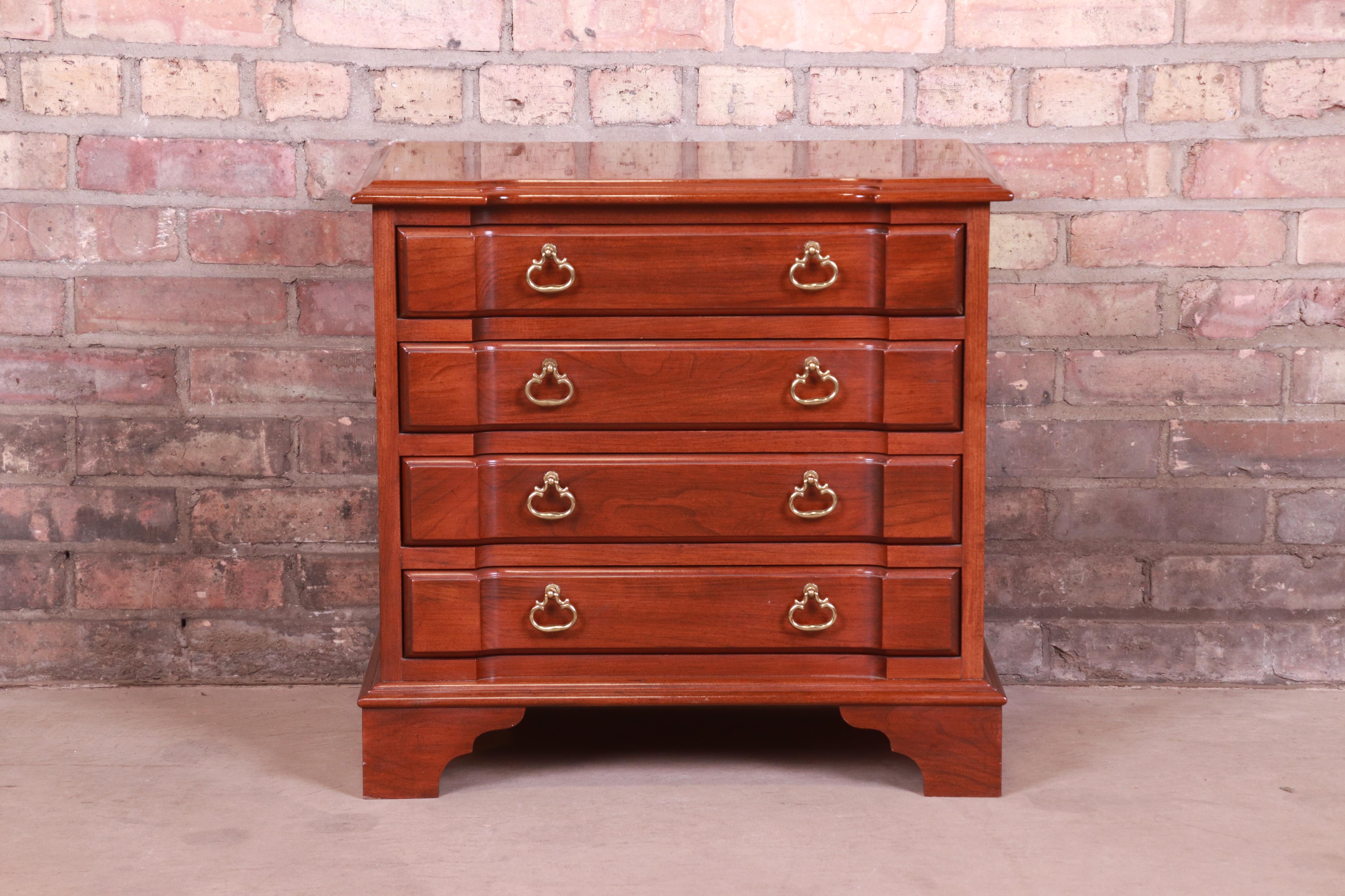 A gorgeous Chippendale style four drawer chest or nightstand

USA, Circa 1980s

Carved mahogany, with original brass hardware.

Measures: 22.5