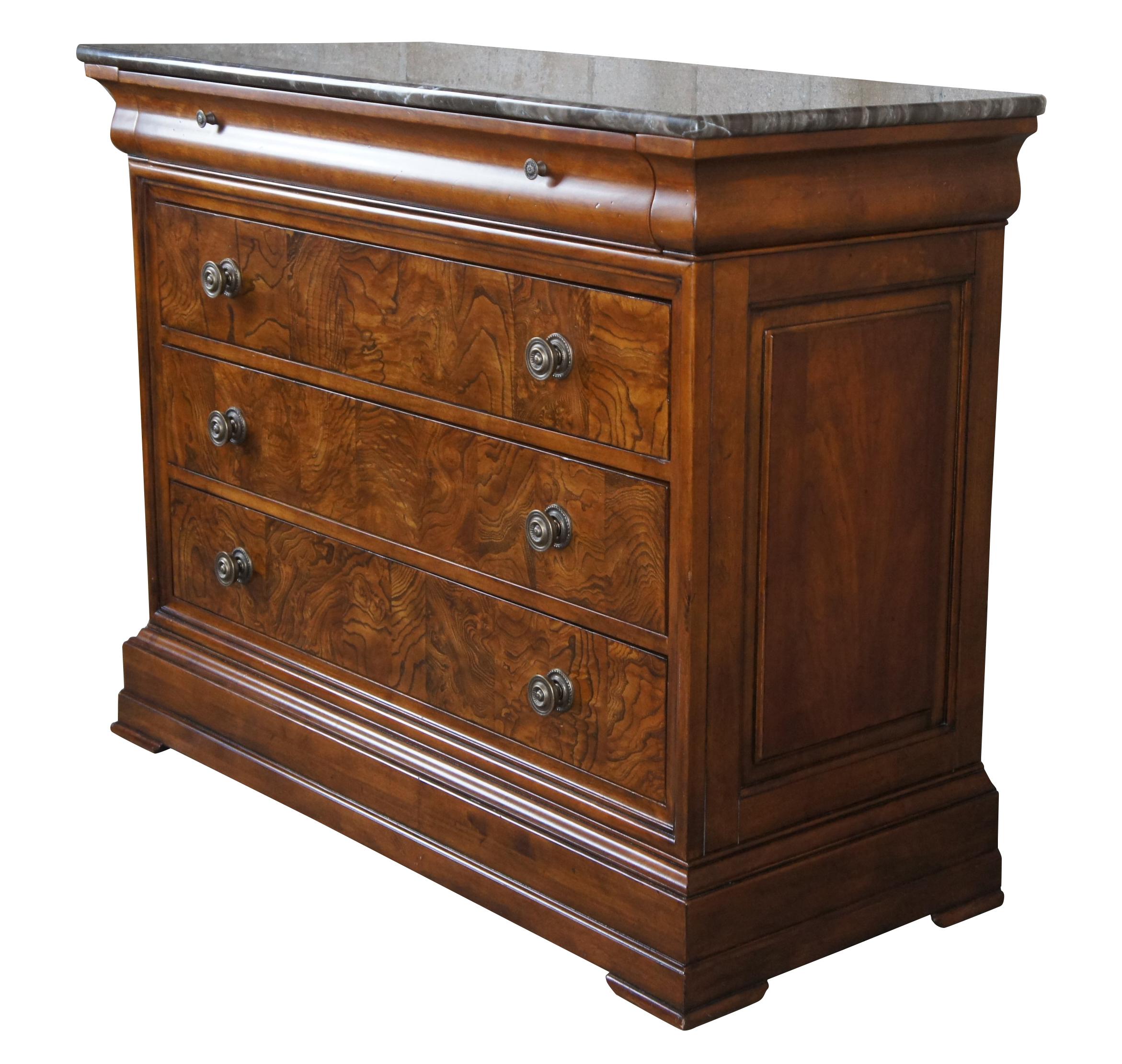 Ethan Allen Townhouse collection French Louis Philippe inspired chest of drawers, console or dresser. A rectangular form made from cherry with three drawers featuring an ash wood burl front and brass pulls. Includes an upper cornice drawer and