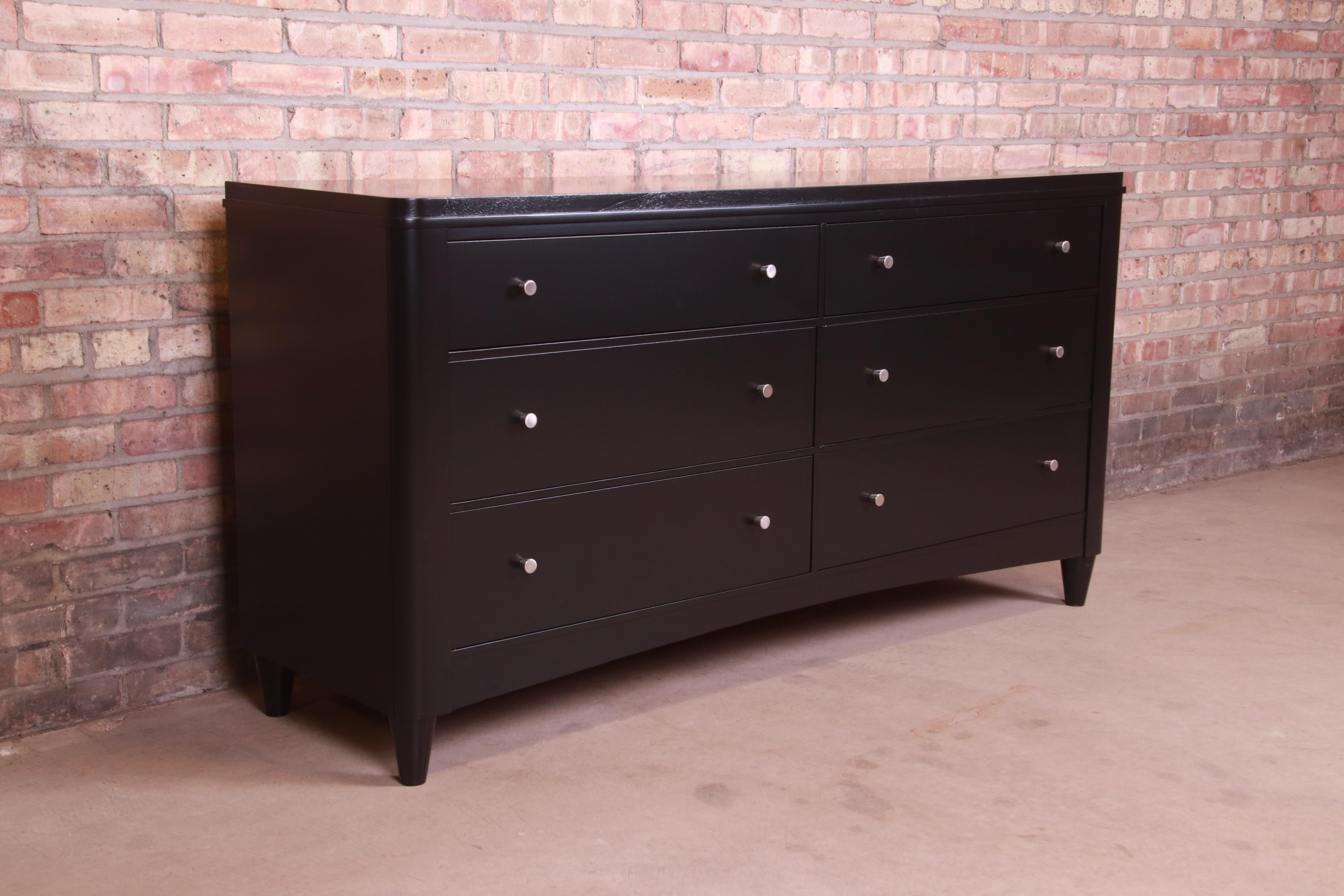 An exceptional modern six-drawer dresser or credenza

By Ethan Allen

USA, Circa 1990s

Black lacquered solid maple, with brushed nickel hardware.

Measures: 64.5