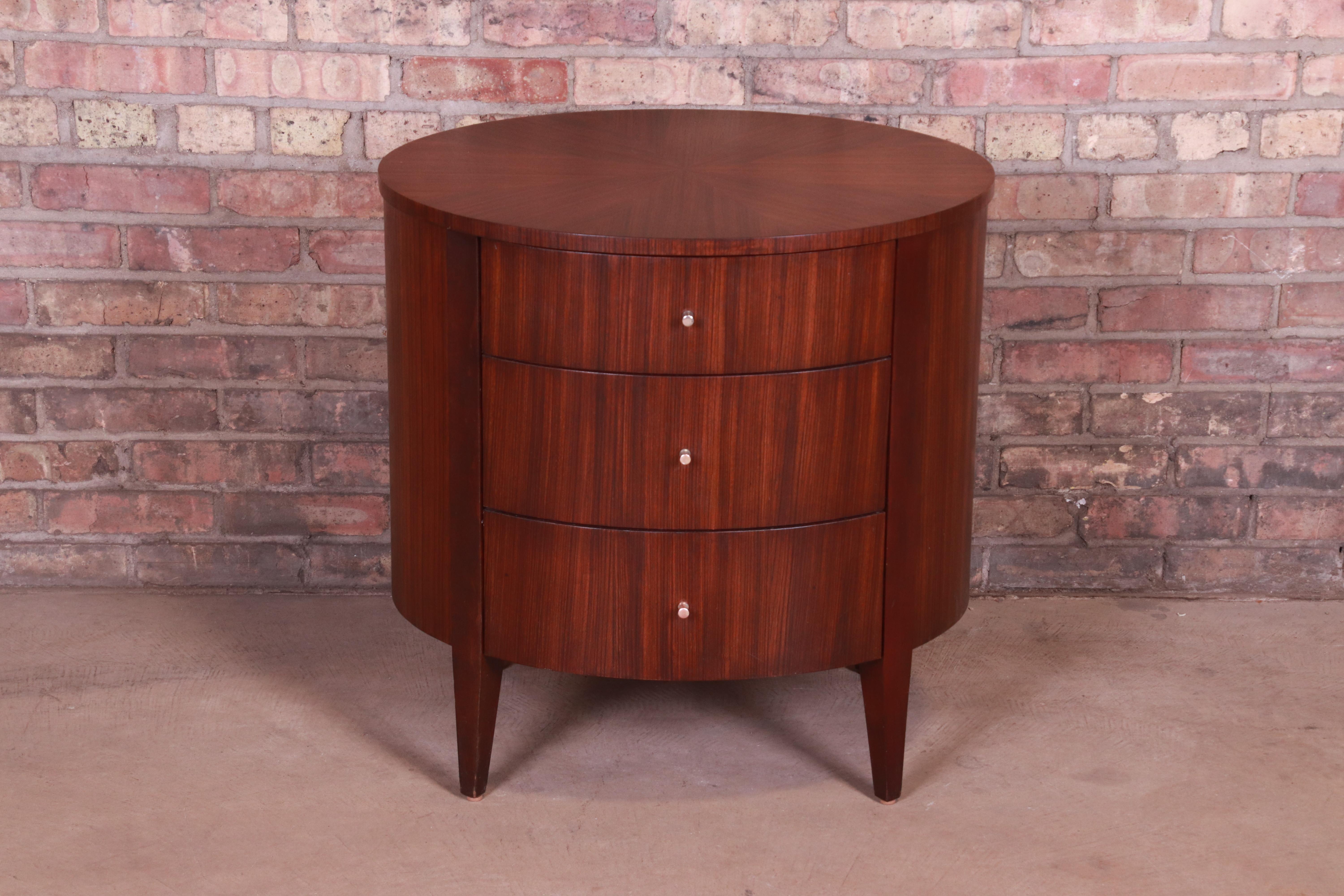 A stylish modern three-drawer walnut nightstand or small chest of drawers

By Ethan Allen

USA, circa 1990s

Measures: 26