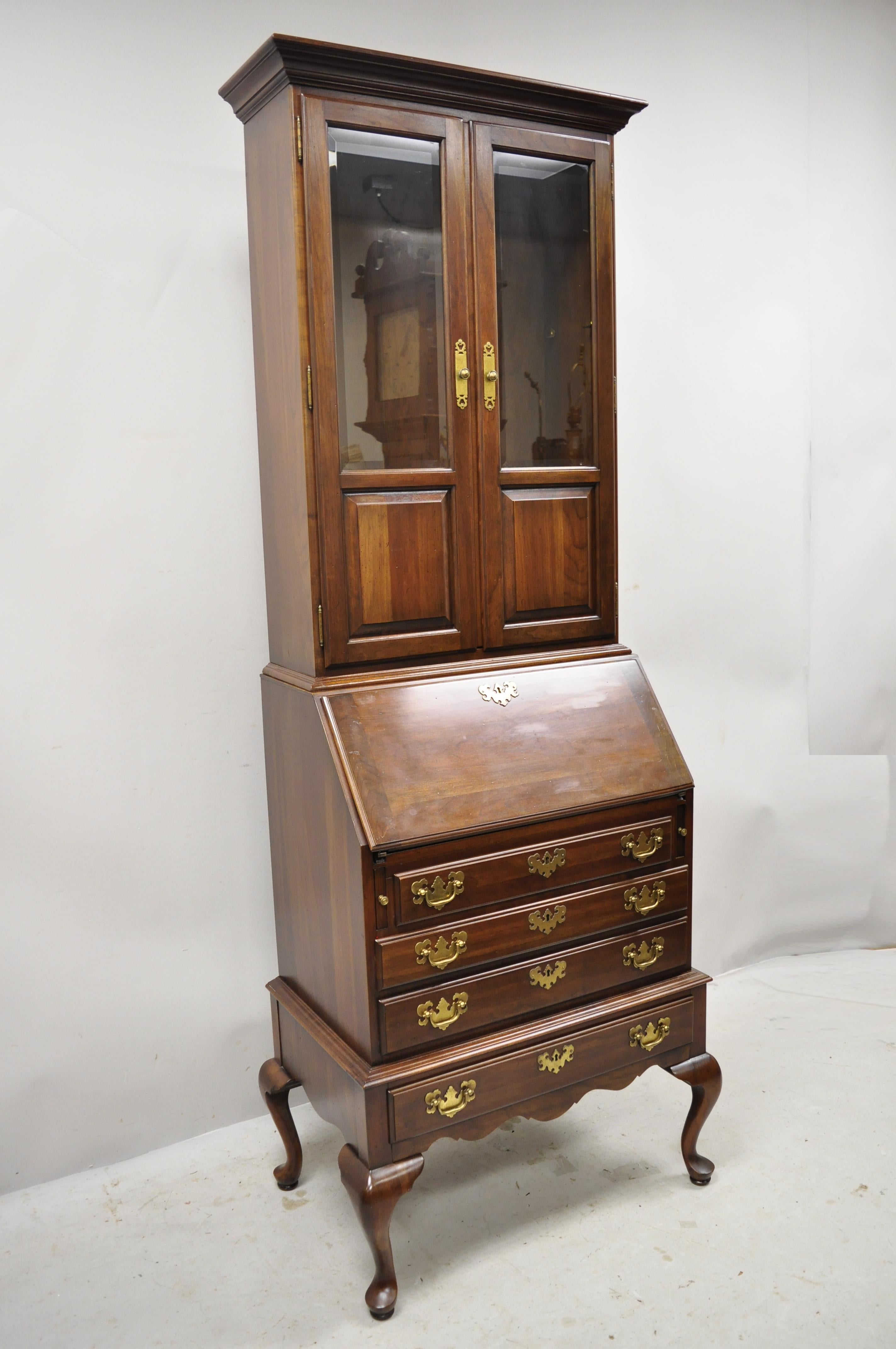 Ethan Allen Queen Anne cherrywood drop front secretary desk with curio top. Item features solid wood construction, beautiful wood grain, 2-part construction, 2 glass swing doors, original stamp, 4 dovetailed drawers, 2 adjustable shelves, shapely