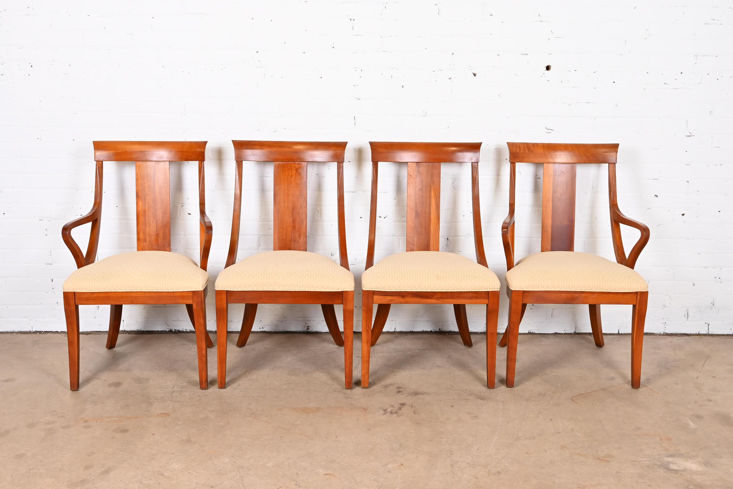 A gorgeous set of four Regency Klismos style dining chairs

By Ethan Allen

USA, late 20th century

Carved cherry wood frames, with upholstered seats.

Measures:
Side chairs: 21.63