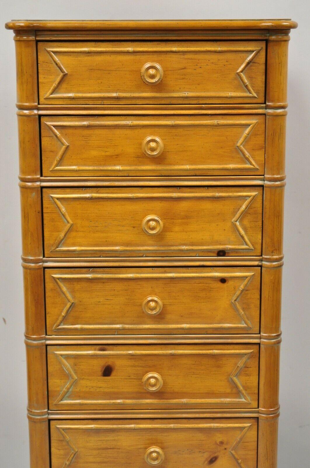 Ethan Allen Regency style faux bamboo 7 drawer Lingerie chest tall dresser. Item features faux bamboo columns, solid pine wood frame, beautiful wood grain, distressed finish, original label, 7 dovetailed drawers, quality craftsmanship, great style