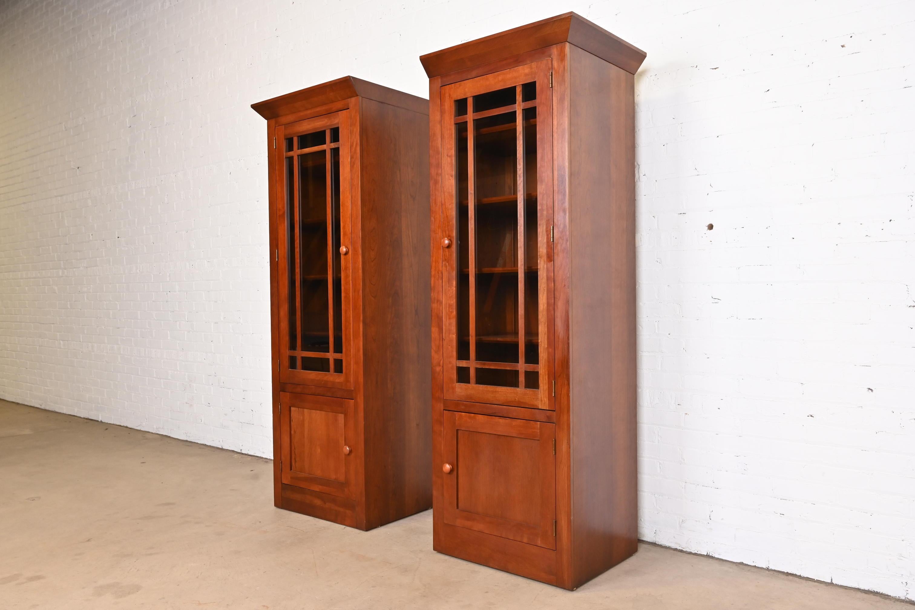A gorgeous pair of Shaker or Arts & Crafts style bookcases or media cabinets

USA, Circa 1990s

Beautiful solid cherry wood, with mullioned glass front doors.

Each measures: 26.25