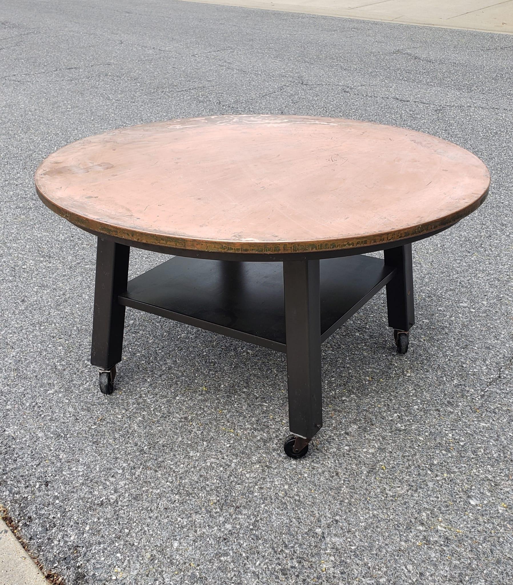 Ethan Allen Outdoor Copper Top Metal Rolling Outdoor or Indoor Coffee or cocktail Table. Copper Top. Very sturdy. Some patina on copper
Table measures 36