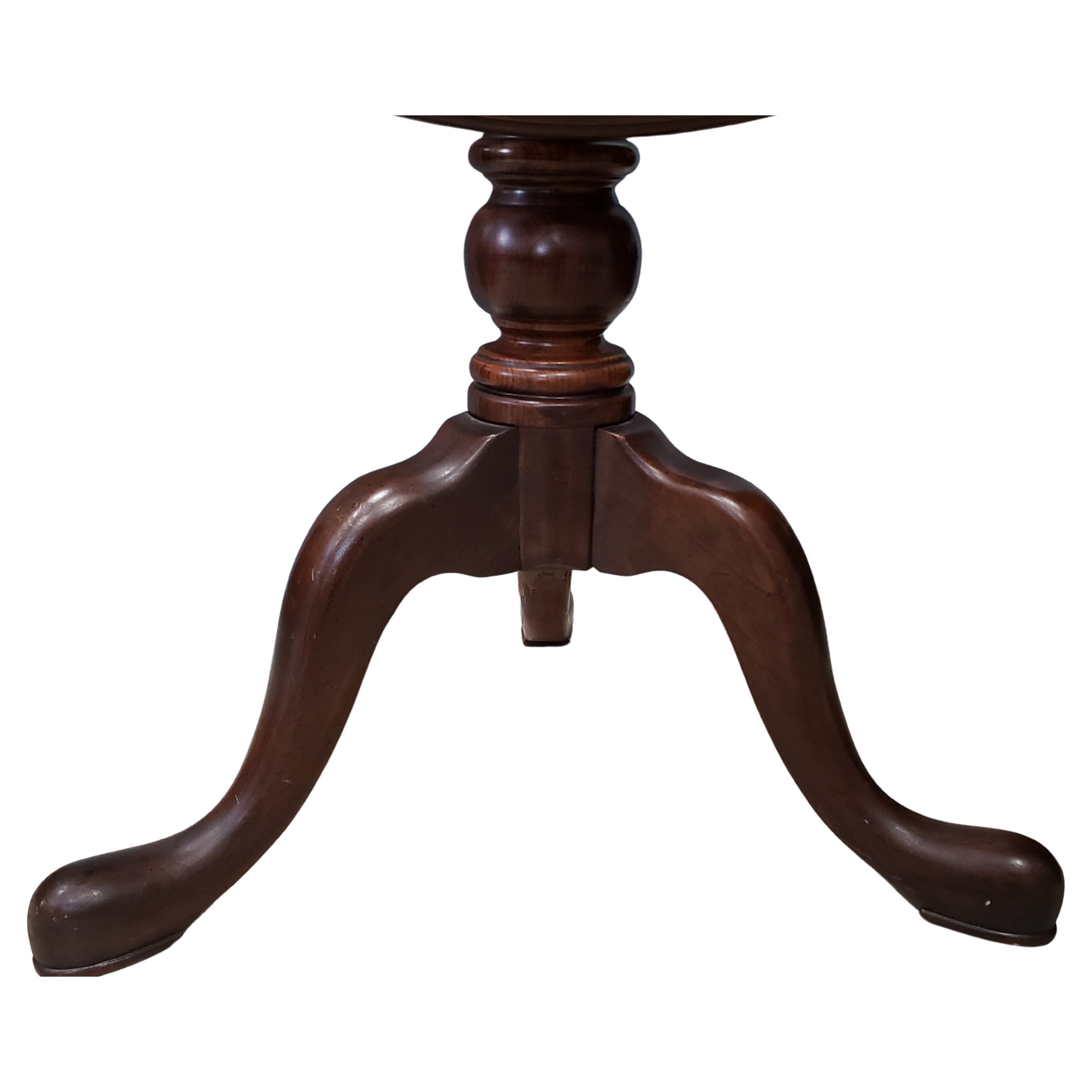 Ethan Allen's Georgian Court collection black cherry tilt top table. Table top spins and is detachable from base for easier handling.
Pad feet tripod pedestal base.
Good original finished condition.
A Good original finished condition.