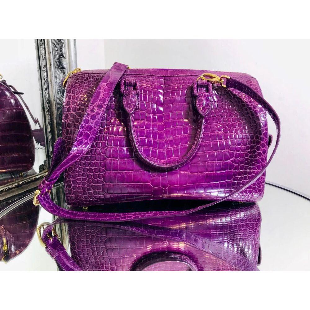 Ethan K Crocodile Skin Bowler Bag

Lustrous shiny purple Crocodile skin with gold hardware and rhinestone details to the zippers and side pockets Removable shoulder strap. Rolled carry handles Bright yellow interior.

Additional information:
Size: