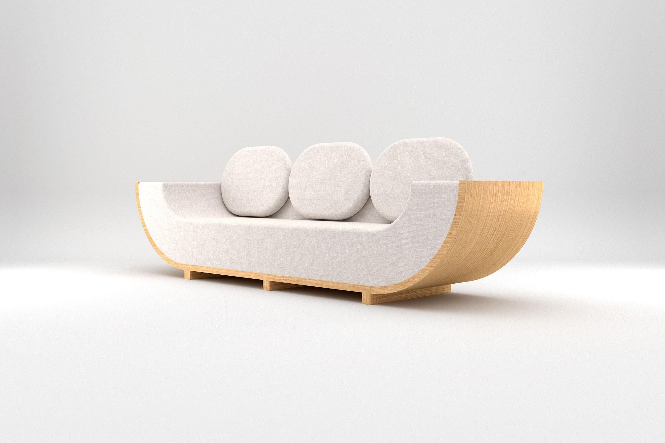 Las siluetas redondeadas de la colección Éter ponen de manifiesto la belleza elemental de la geometría básica, fusionándola con la calidez de la madera natural y la elegancia de sus cándidos tejidos. La pieza fue diseñada y fabricada por Prieto