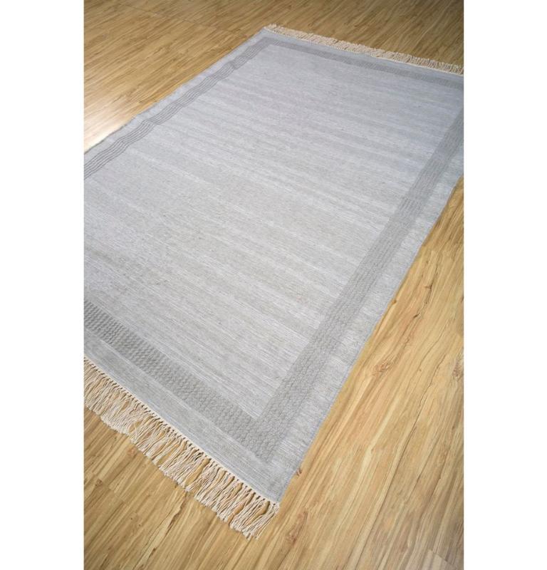 Embrace the allure of simplicity with our Flatweave rug, a masterpiece of minimalism. From unembellished patterns to subtle gradients, its design exudes sophistication. The light silver color scheme adds a touch of modern elegance, ensuring seamless