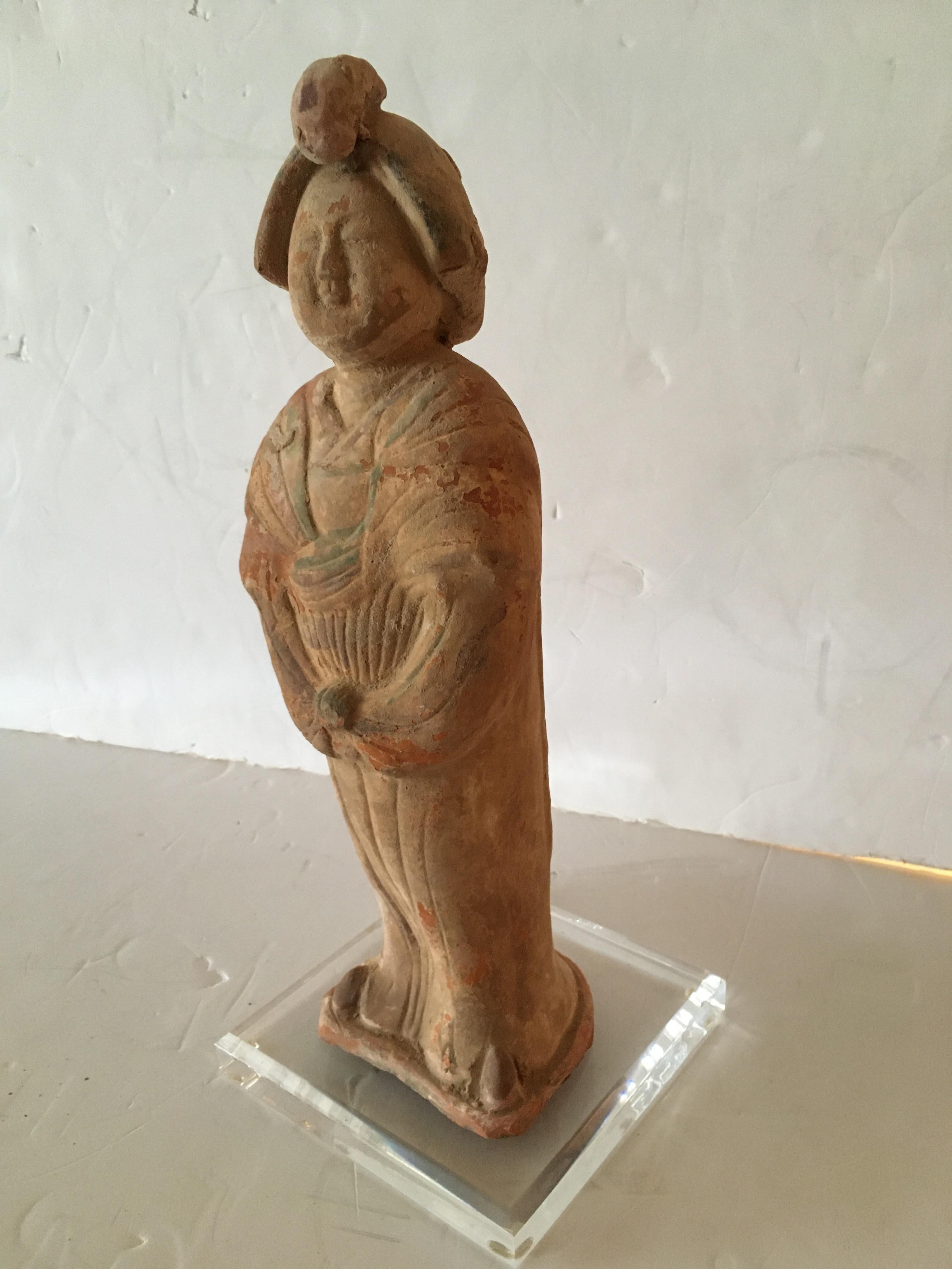 Lovely terracotta sculpture of an Asian figure with beautiful weathered patina. Custom lucite base.