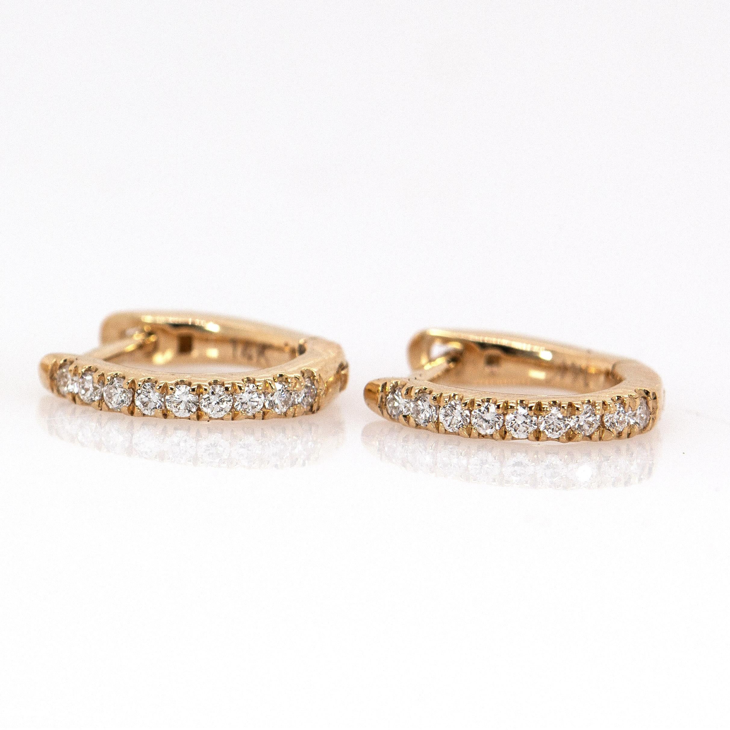 A beautiful gift for someone special—or yourself. These 14K yellow gold diamond huggies feature ethically sourced, earth-mined diamonds and a secure latch back. With their 10mm diameter, they strike the perfect balance between subtle and