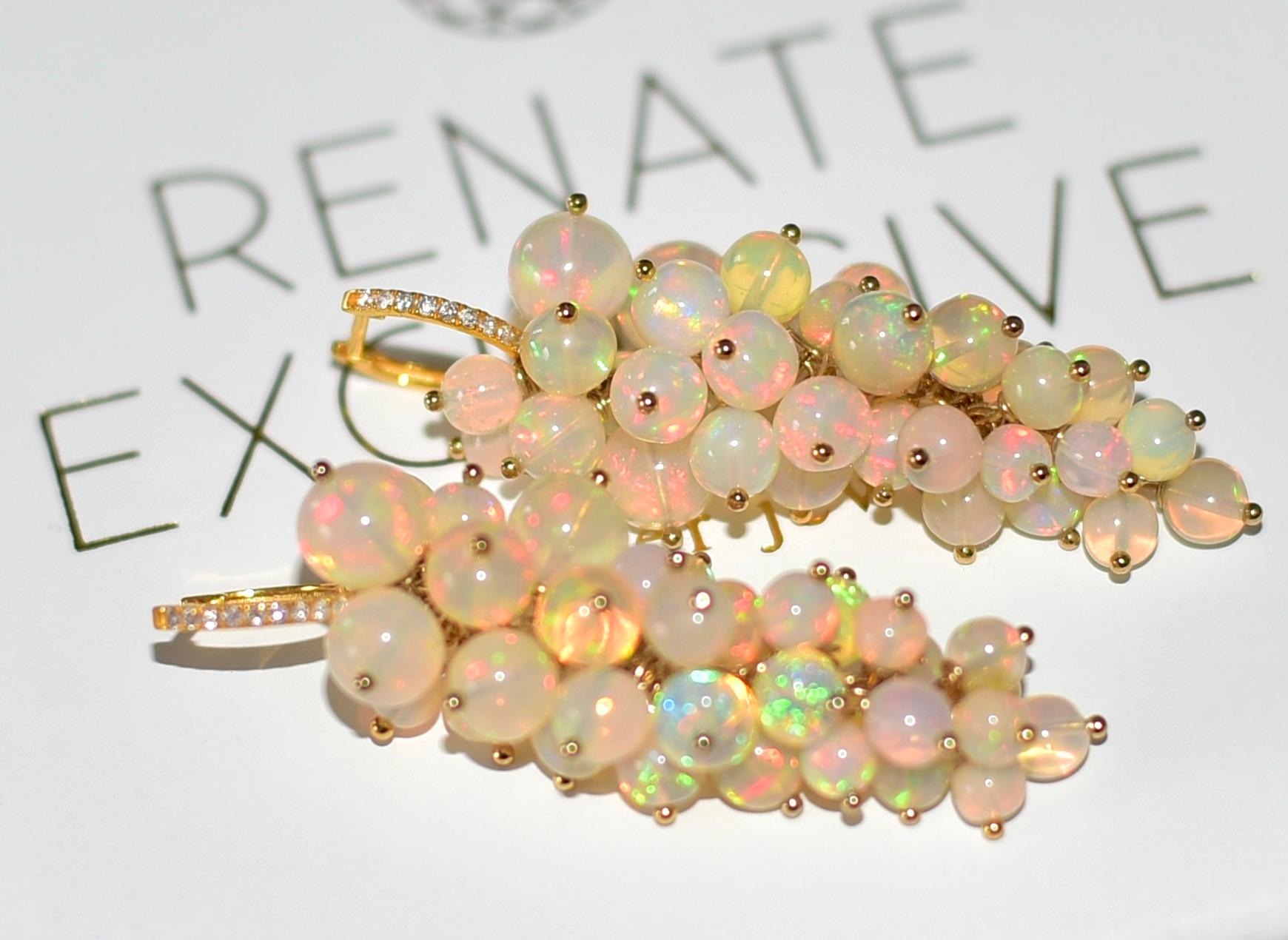 Luxurious Ethiopian Crystal Opal earrings (bead sizes 3.5mm .6mm). These wonderful earrings are timeless, elegant, and unique for every festive moment. A real cherry for opal lovers! 
Total length 1.8 inches-

Watch the video, what a flash of colors!
