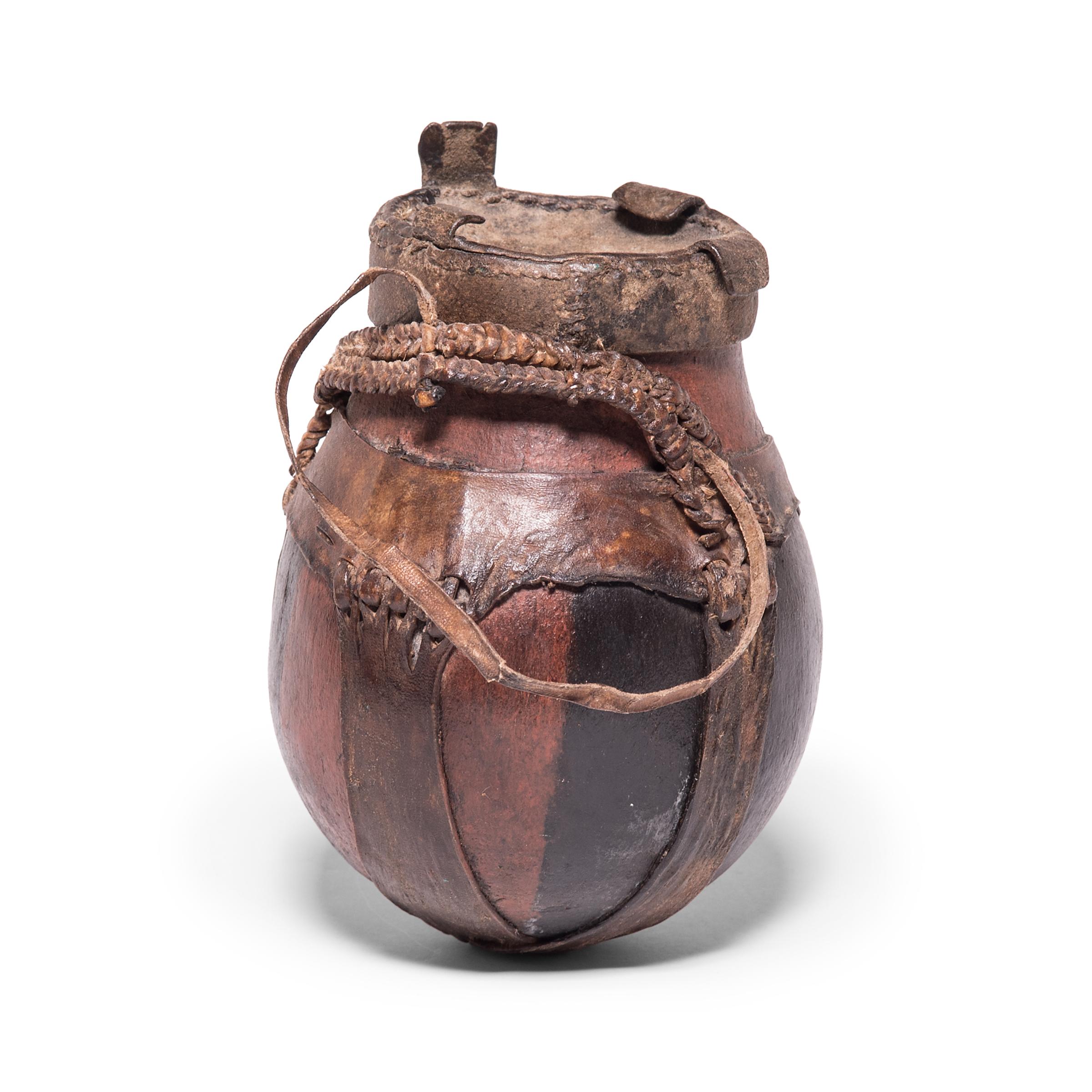 The Borana Oromo people of southern Ethiopia and northern Kenya are historically a cattle-keeping culture, and each household keeps a number of traditional vessels for storing and churning cow's milk. This rounded vessel would have been used within