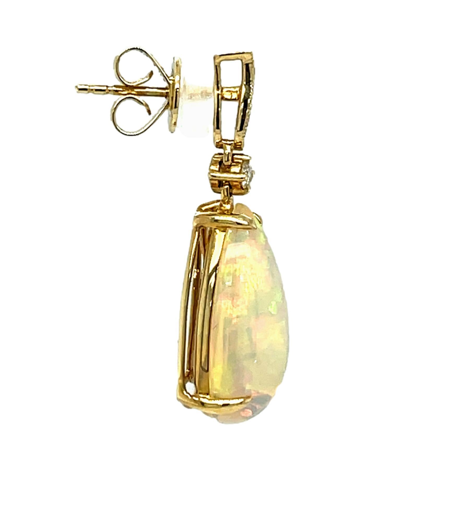 Oval Cut Ethiopian Opal and Diamond Dangling Earrings in 14KY Gold  For Sale