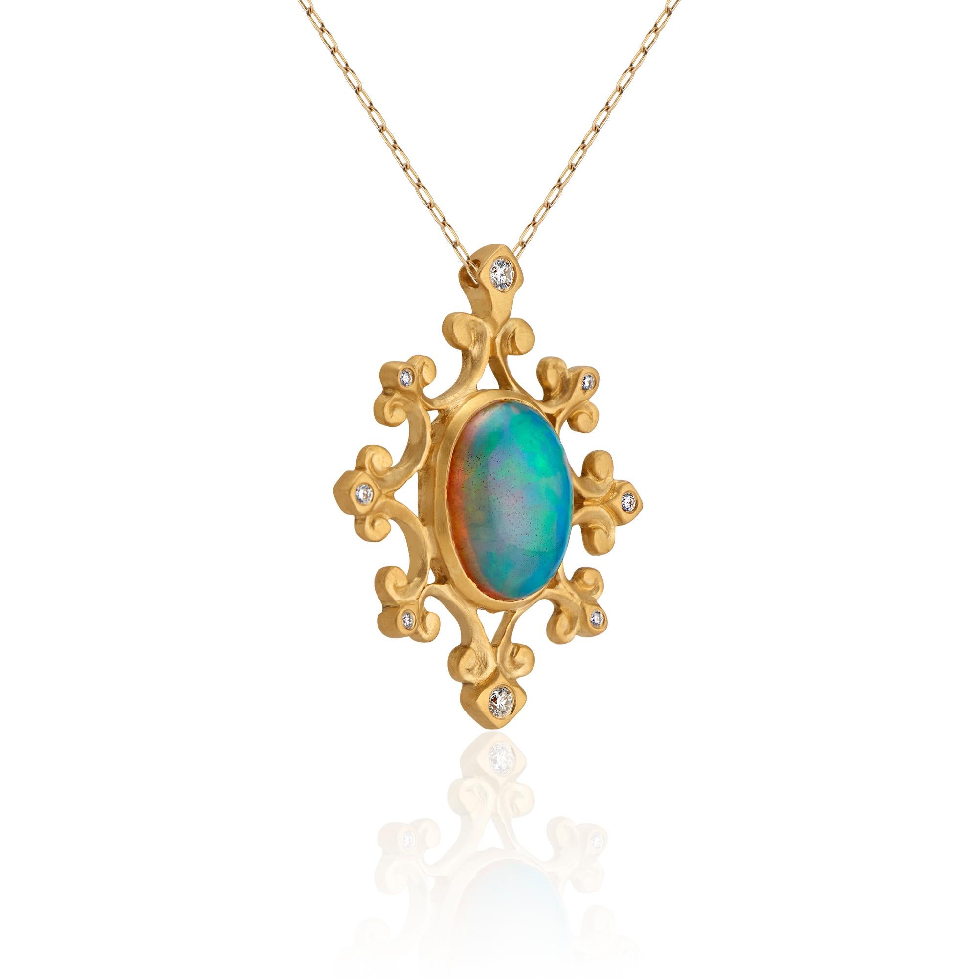 A 22k gold medallion, centered with a .47 inch wide x .6 inch tall (12 x 15 millimeter) Ethiopian opal, 3.93 carats. Surrounded by eight trefoil motifs, studded with diamonds (approximately .11 total carat weight). Medallion is approximately 1 inch