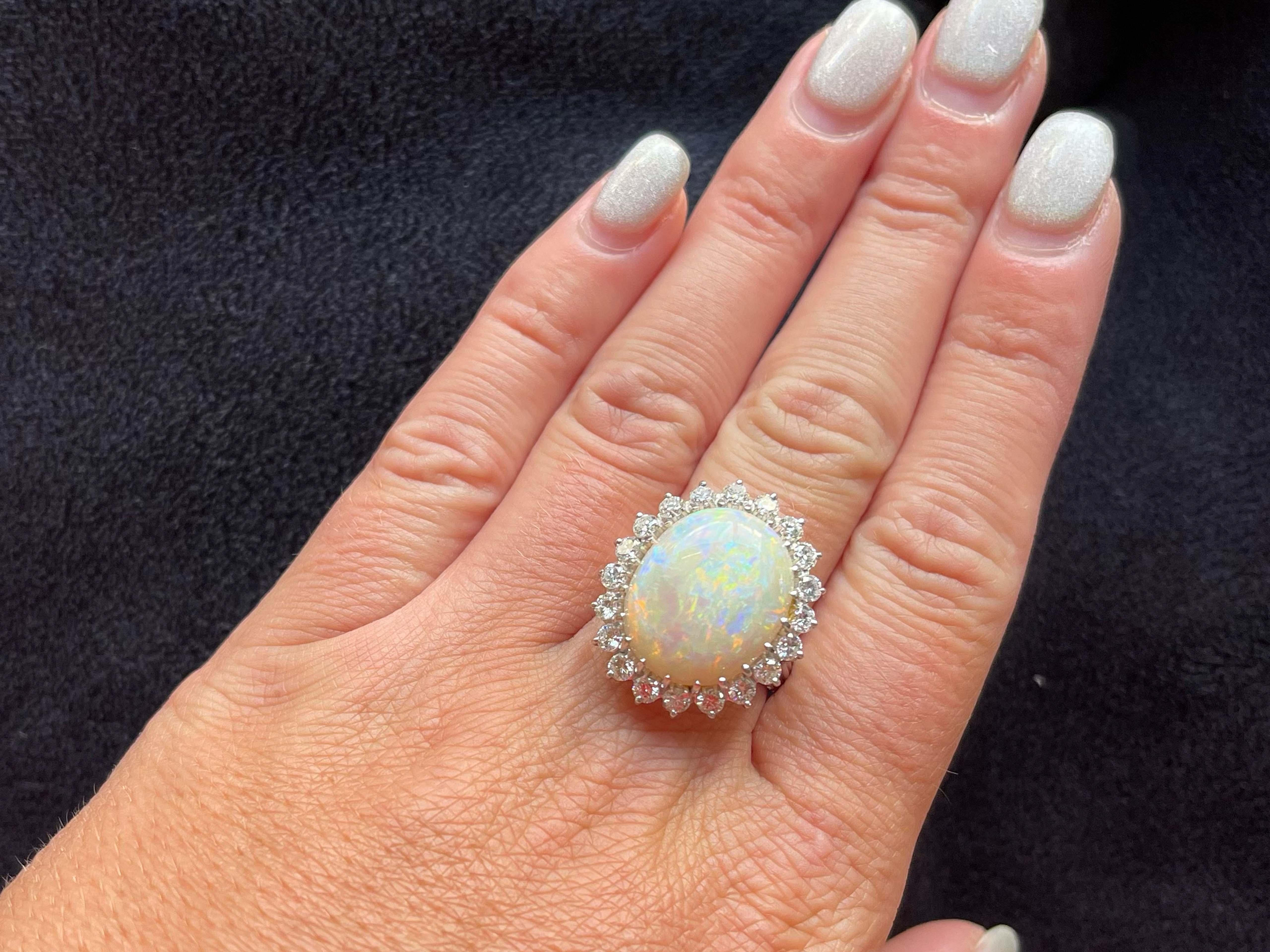 Item Specifications:

Metal: 14K White Gold 

Style: Opal and Diamond Ring

Total Weight: 7.3 Grams
​
​Ring Size: and 8.25 (resizing available for a fee)

Gemstone Specifications:

Center Gemstone: Ethiopian Opal

Gemstone Measurements: 18.5 mm x