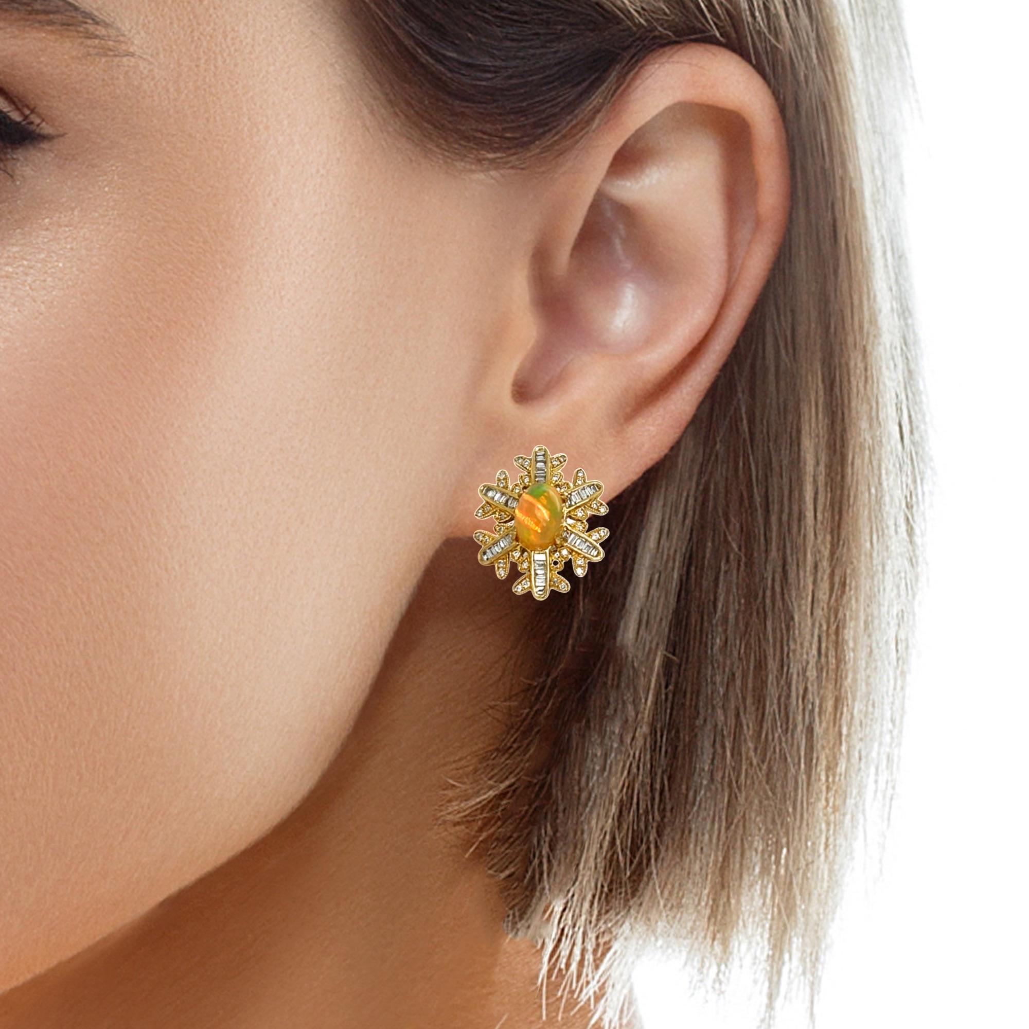 These stunning Ethiopian Opal and diamond snow flake earrings are a beautiful accessory for any event. The oval opal has a 4 prong setting in 14 karat yellow gold. There are sparkling baguette and round diamonds surrounding the opal for a beautiful