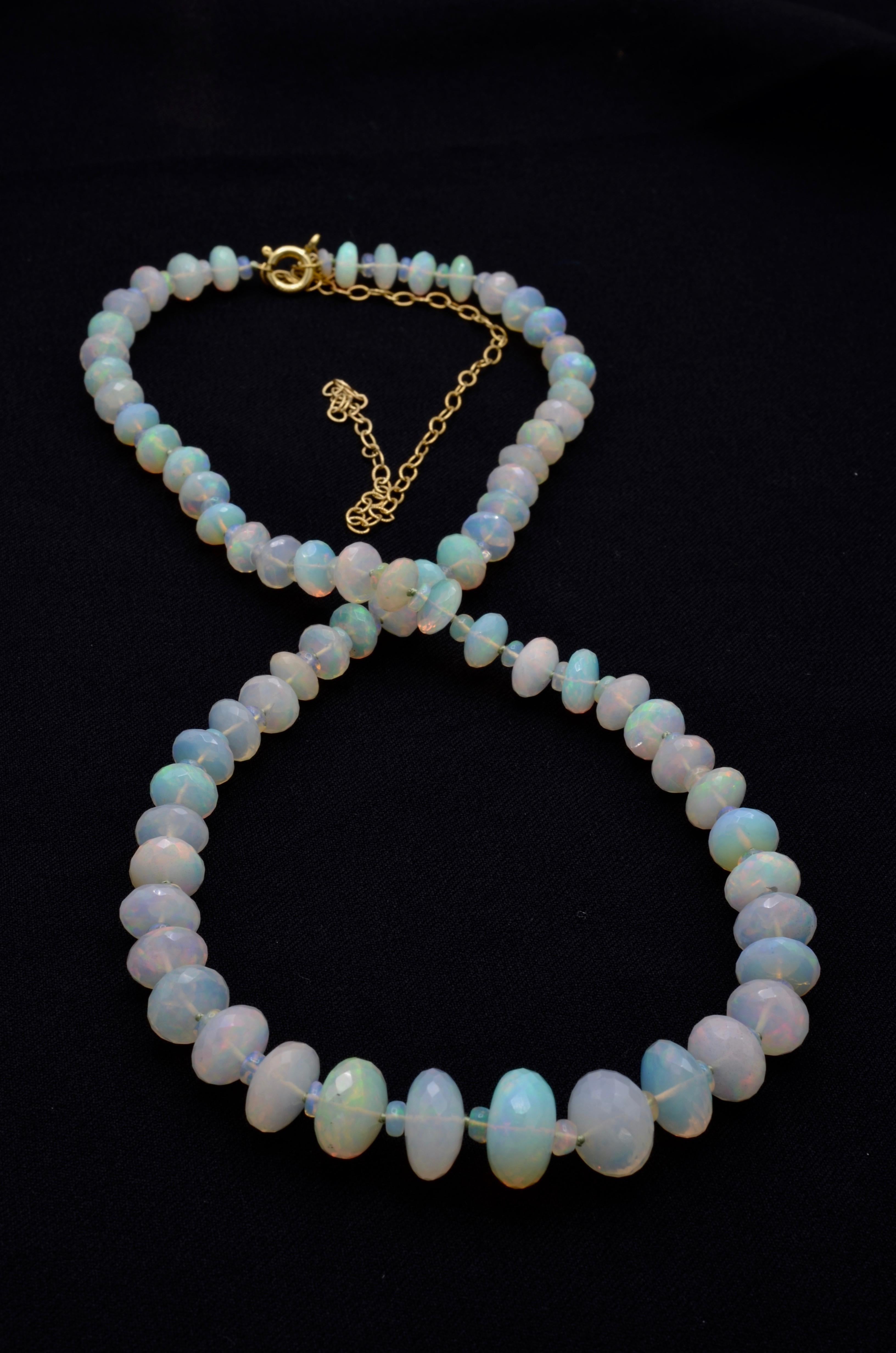 Milky and mysterious these opal faceted beads come from Ethiopia.The facets add sparkle and dimension to the otherworldly glow. Stunning!! There is a 14k gold chain extension so the 19 1/2