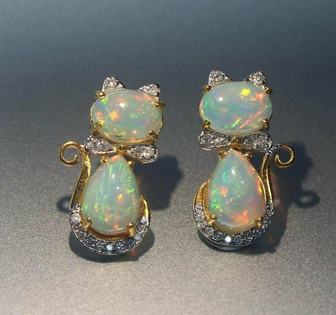 Ethiopian Opal Diamond 14k Solid Gold Kitty Cat Earring Cat Bow Stud Earrings.  pair

Pear Opal Weight/Size
7x10 mm / 3.30 cts Approx
Gold Weight
2.58 Grams Approx
Country/Region of Manufacture
India
Style
Stud
Base Metal
Yellow Gold,