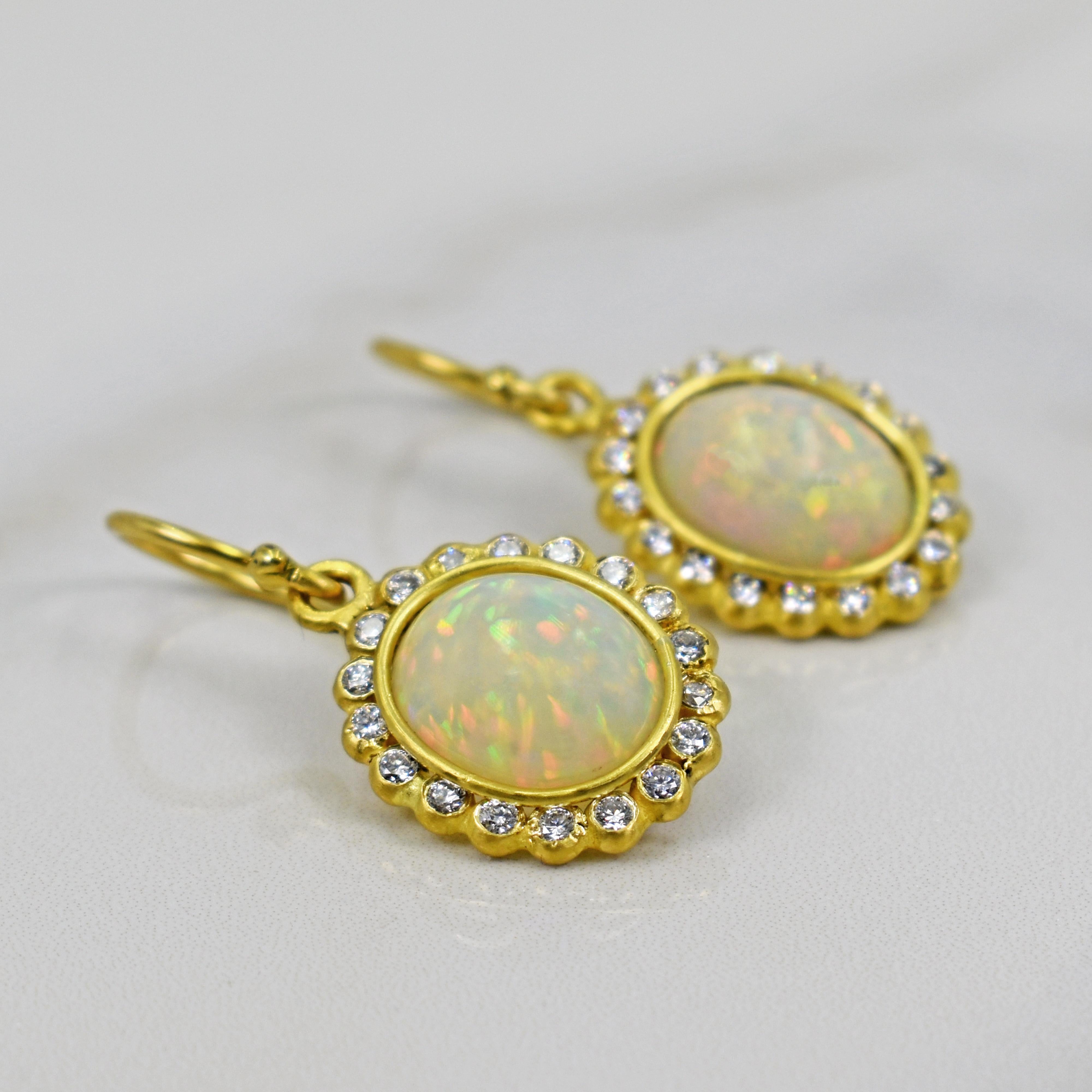 Vicki Orr Designs AAA Ethiopian Opal gemstones and 0.54 carat diamond halos set in 22k yellow gold dangle earrings. Earrings are 1.19 inches in length. Gorgeous, artisan dangle earrings with excellent, fiery Opal gemstones. 