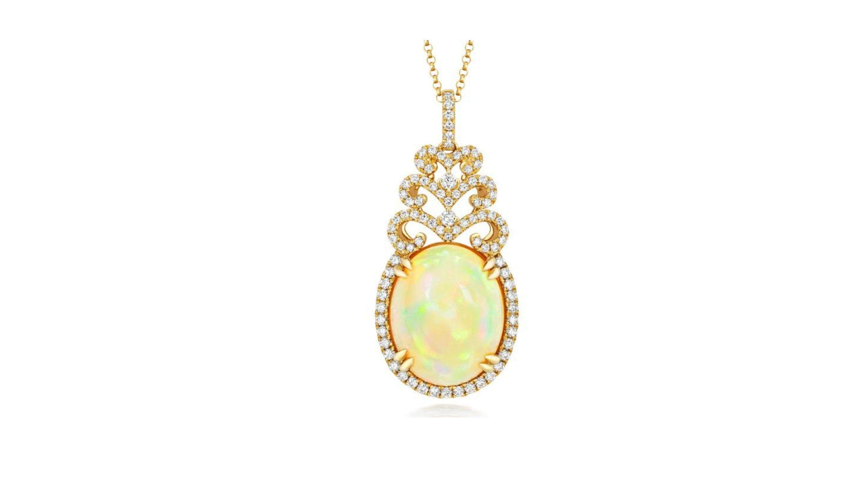
Opulence! This gorgeous regal pendant has been crafted in 18k Yellow Gold and set with glittering fine diamonds and an opulent 8.41ct Ethiopian Opal. Its really does stand out and shows off flashes of colors yellow blue  white etc.



