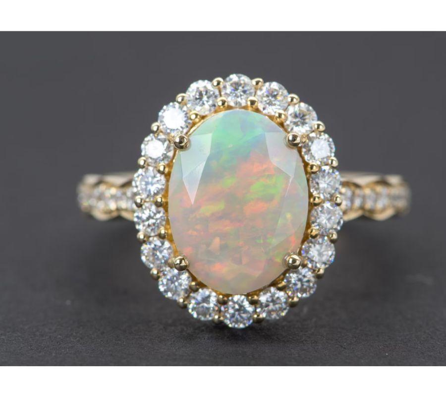 â™¥  Solid 14K gold ring set with a beautiful oval-shaped Ethiopian opal in the center, flanked by a halo of bright white moissanites. The shank is also decorated with gradual-sized moissanites for maximum sparkle!
â™¥  The opal is incredibly fiery
