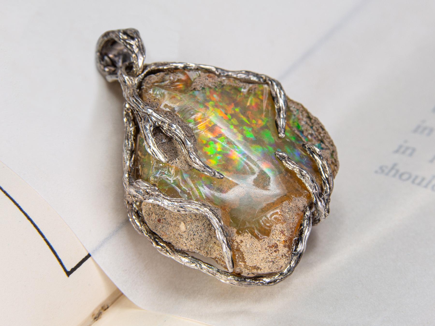 Sterling silver pendant with natural opal nugget

opal origin - Ethiopia 

stone weight - 50 carats

pendant weight - 14.48 grams

pendant height - 1.65 in / 42 mm

stone measurements - 0.59 x 1.1 x 1.26 in / 15 х 28 х 32 mm

Roots collection