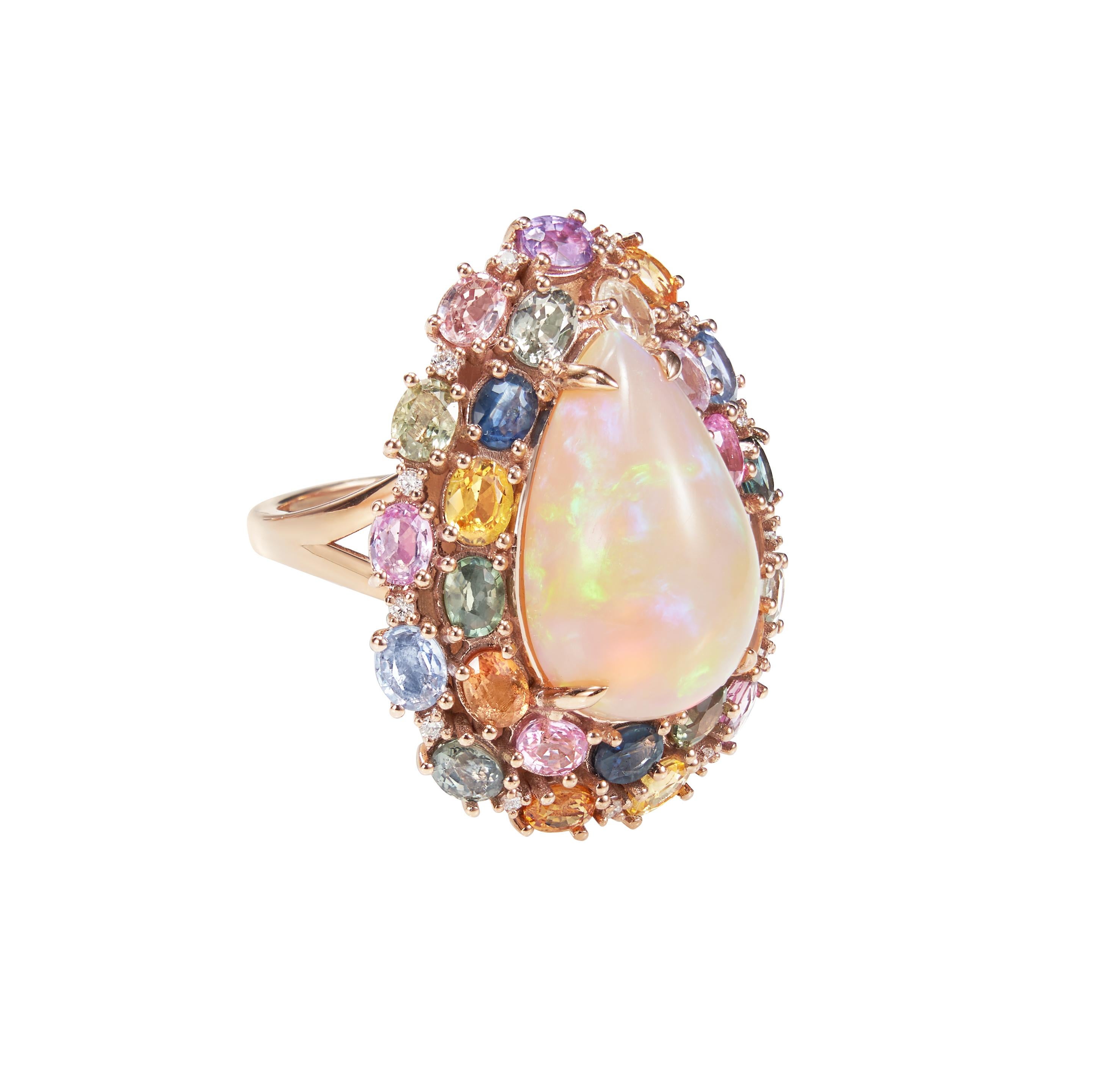 Sunita Nahata presents an exquisite Ethiopian Opal cabochon ring accented with rainbow sapphires and dazzling diamonds to accentuate the fire and sparkle within this colorful opal. The gorgeous and colorful gems on this ring will grab every