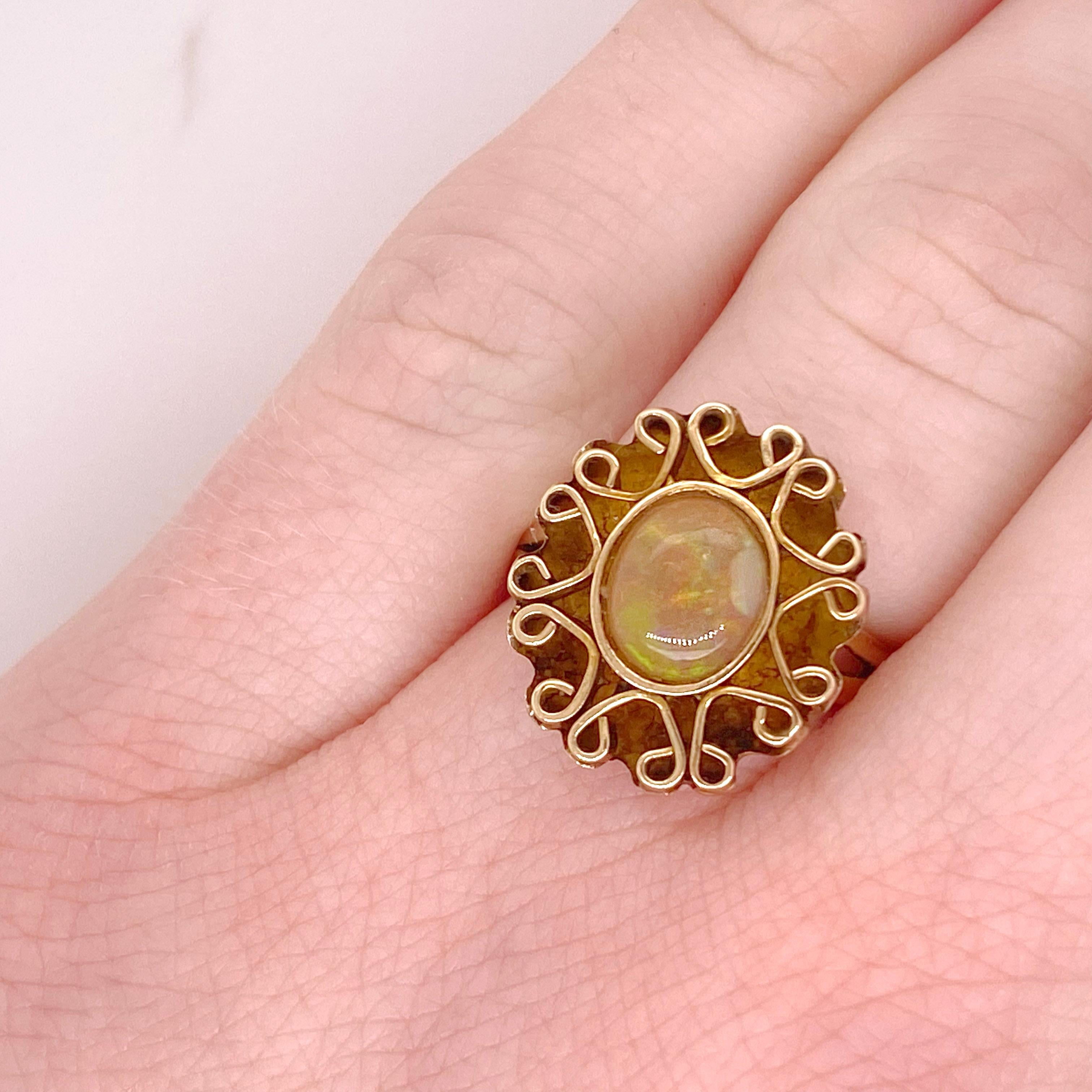 Opals are one of our favorite stones because they contain more than just one beautiful color. This ring is very high quality statement piece and is comfortable on the finger. The filigree surrounding the stone makes this ring even more special than