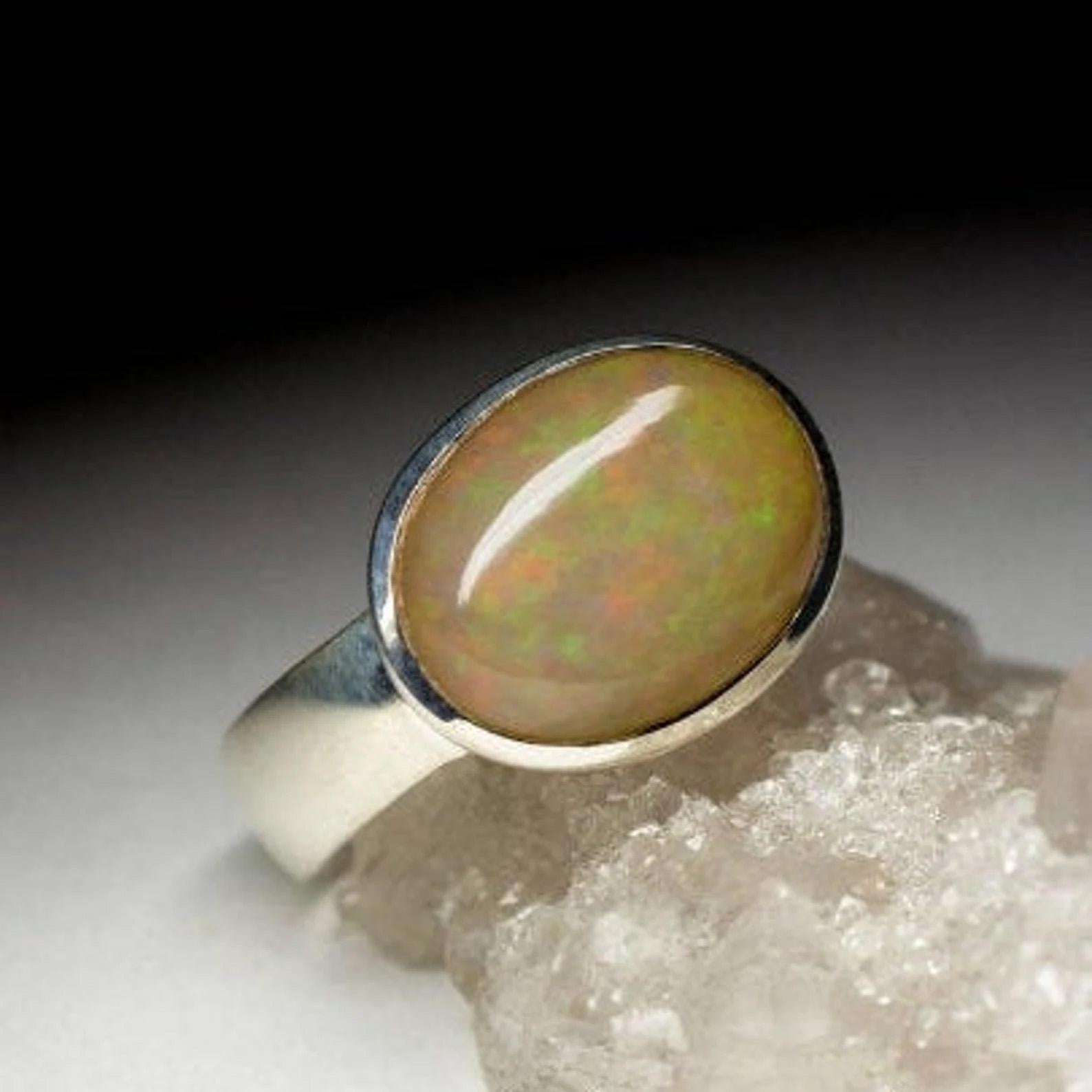 Silver ring with natural Opal 
gemstone origin - Ethiopia
opal weight - 4 carat
ring weight - 4.43 grams
ring size - 8.25 US
gem size is 0.2 х 0.39 x 0.51 in / 5 х 10 х 13 mm