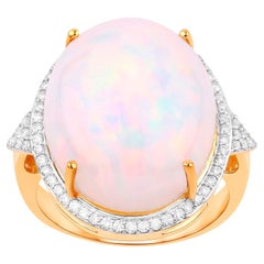 Anillo de oro de 14 quilates con ópalo etíope y halo de diamantes 12,3 quilates en total