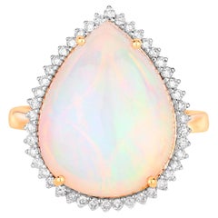 Anillo de oro de 14 quilates con ópalo etíope y halo de diamantes 8,37 quilates en total