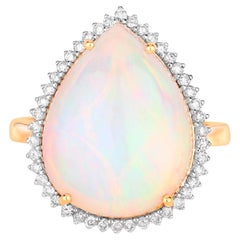 Anillo de oro de 14 quilates con ópalo etíope y halo de diamantes 8,37 quilates en total