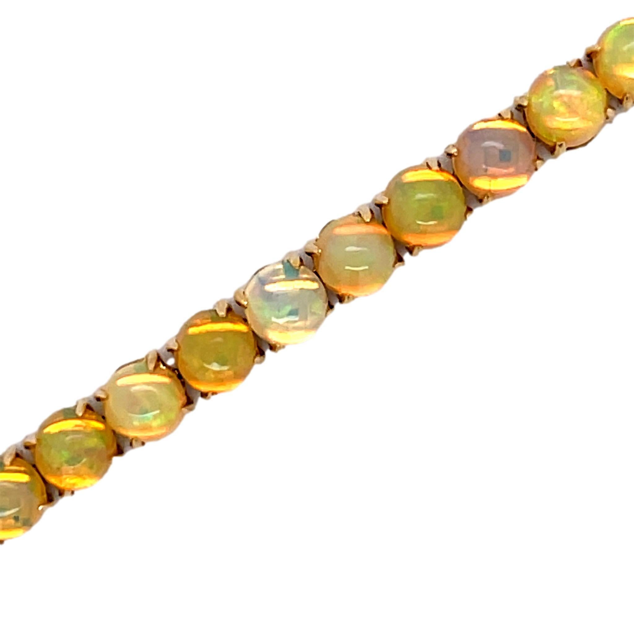 This stunning bracelet has 35 vibrant Ethiopian Opals each set with 4 prongs.  Fun to wear everyday or on that special occasion. There is a double lock for extra security. This bracelet comes with detailed tags attached and is shipped in a beautiful