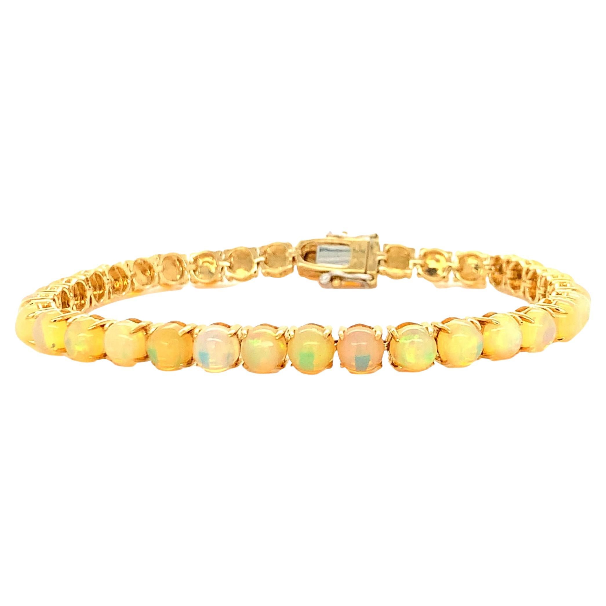 Ethiopian Opal Tennis bracelet in 14K Yellow Gold For Sale