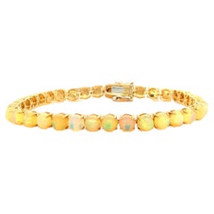Ethiopian Opal Tennis bracelet in 14K Yellow Gold