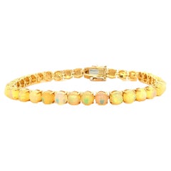 Vintage Ethiopian Opal Tennis bracelet in 14K Yellow Gold