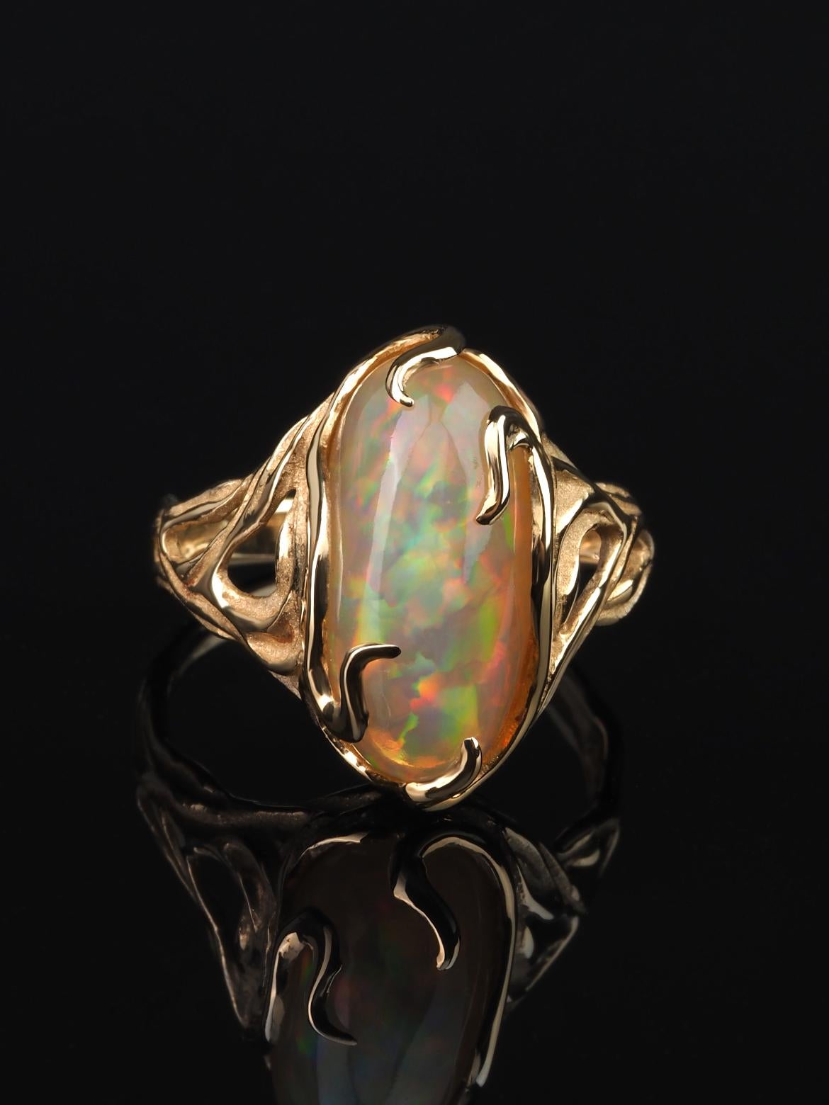 14K yellow gold ring with natural Opal  
opal origin - Ethiopia 
opal measurements - 0.28 х 0.31 х 0.71 in / 7 х 8 х 18 mm
stone weight - 5.80 carats
ring weight - 5 grams
ring size - 7.25 US

We ship our jewelry worldwide – for our customers it is