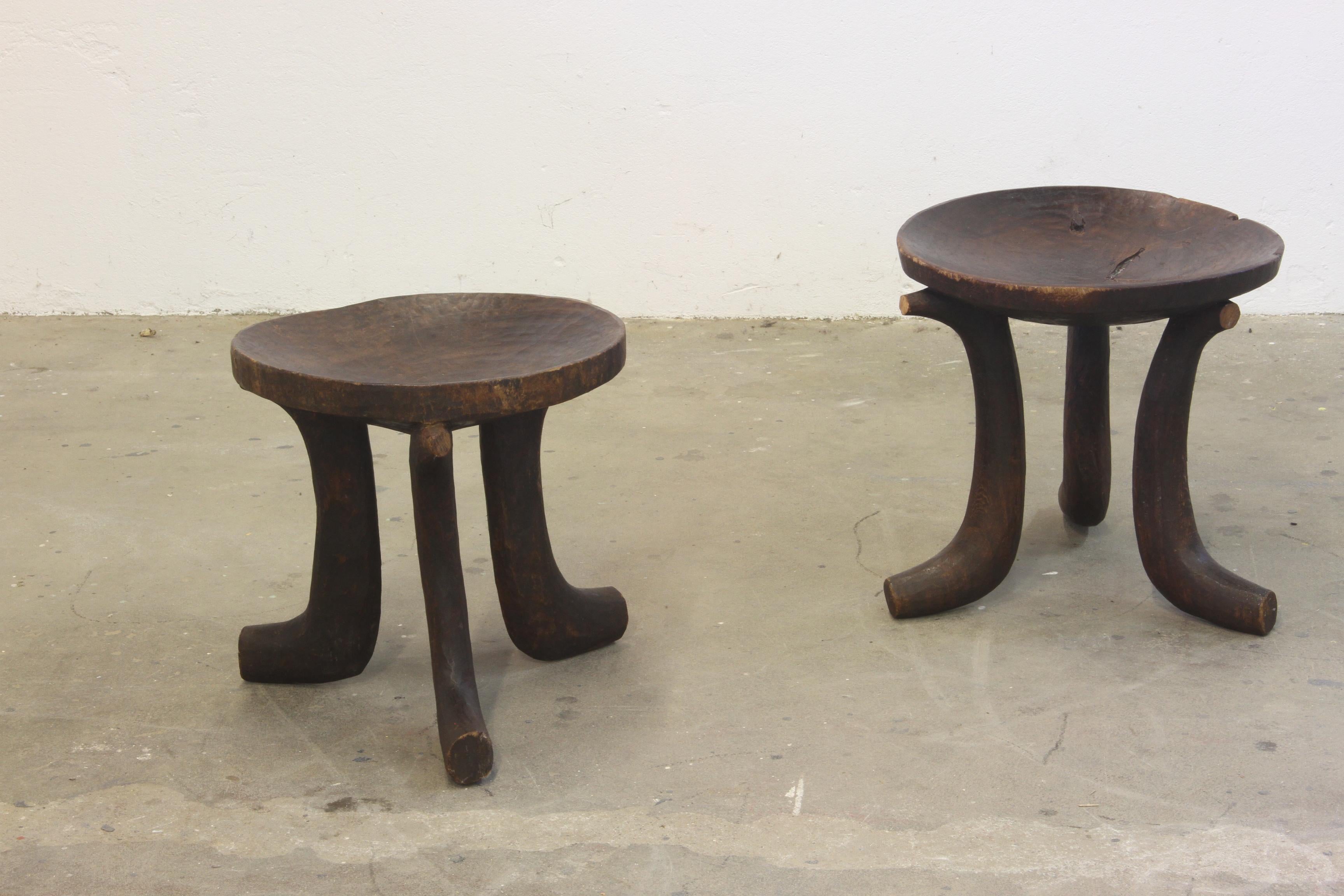Original hand-carved Oromo stool from Ethiopia, early 20th century. Crafted from a single piece of wood, it features a beautifully curved, bowl-shaped seat supported by three sturdy legs.

With its rich patina and timeless design, this piece exudes