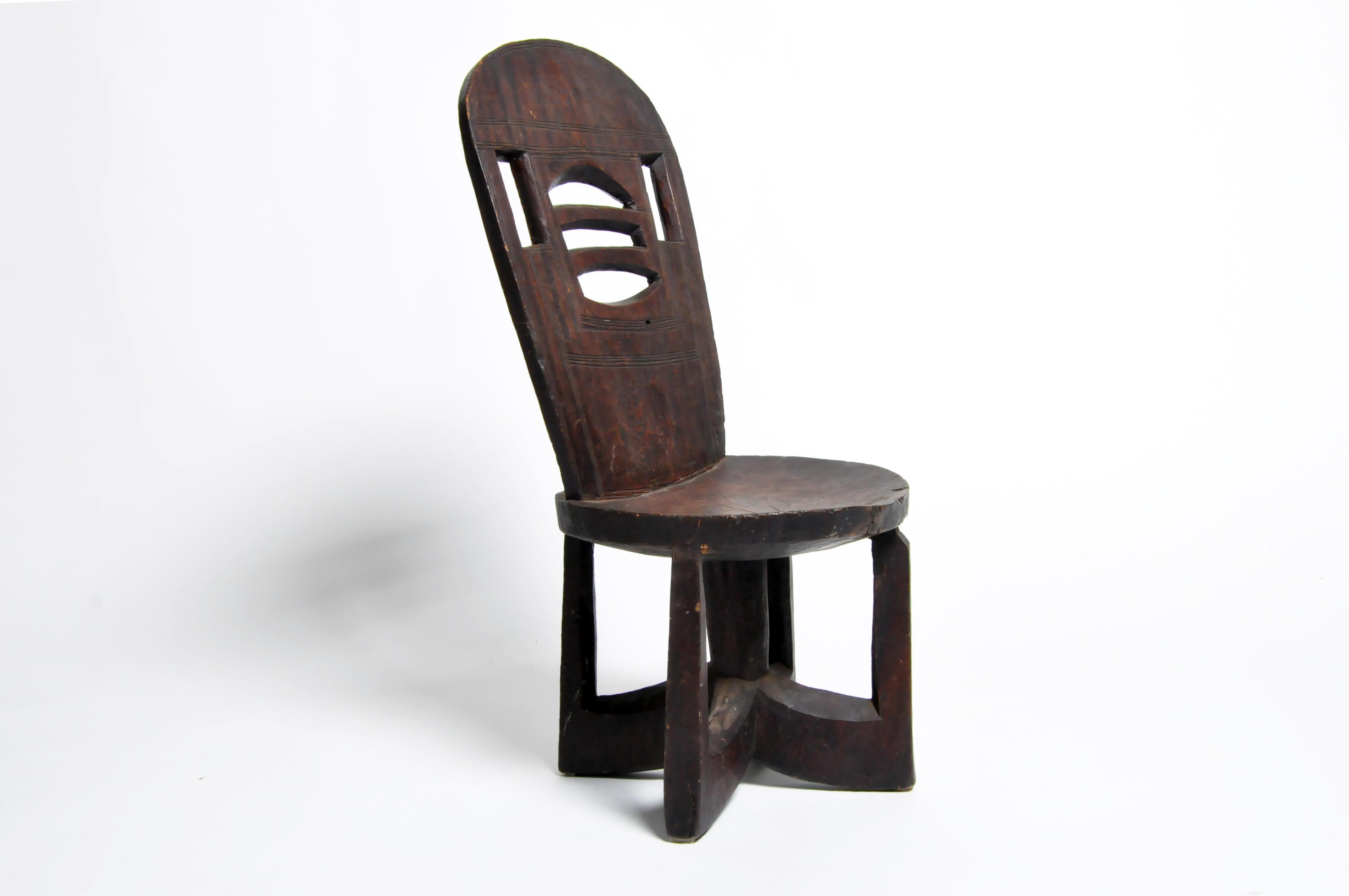 Ethiopian tribal chair; hand-carved mahogany, made from a single piece of wood, circa 20th century.