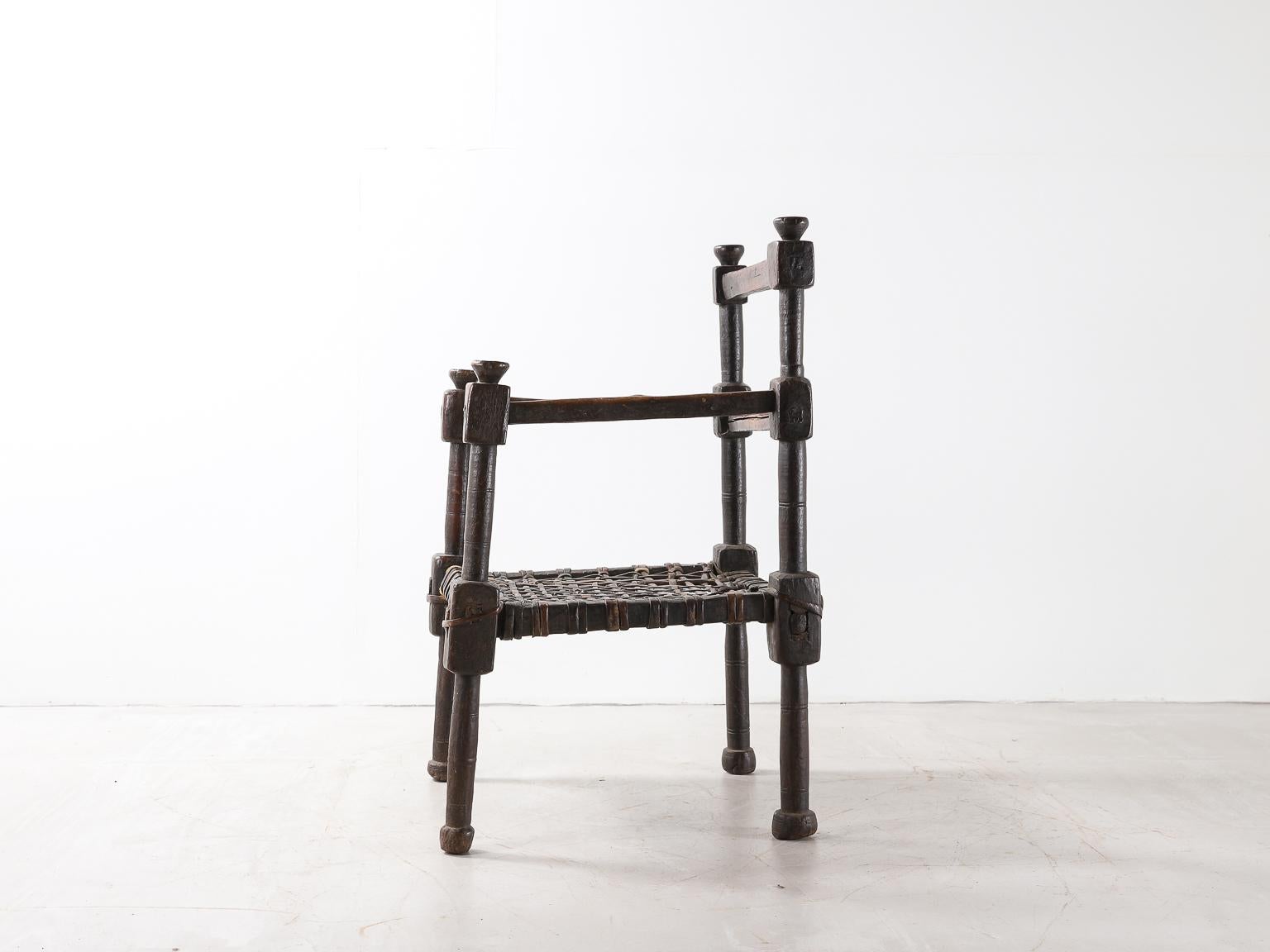 Hand-Carved Ethiopian Tribal Chair with Woven Leather Seat For Sale