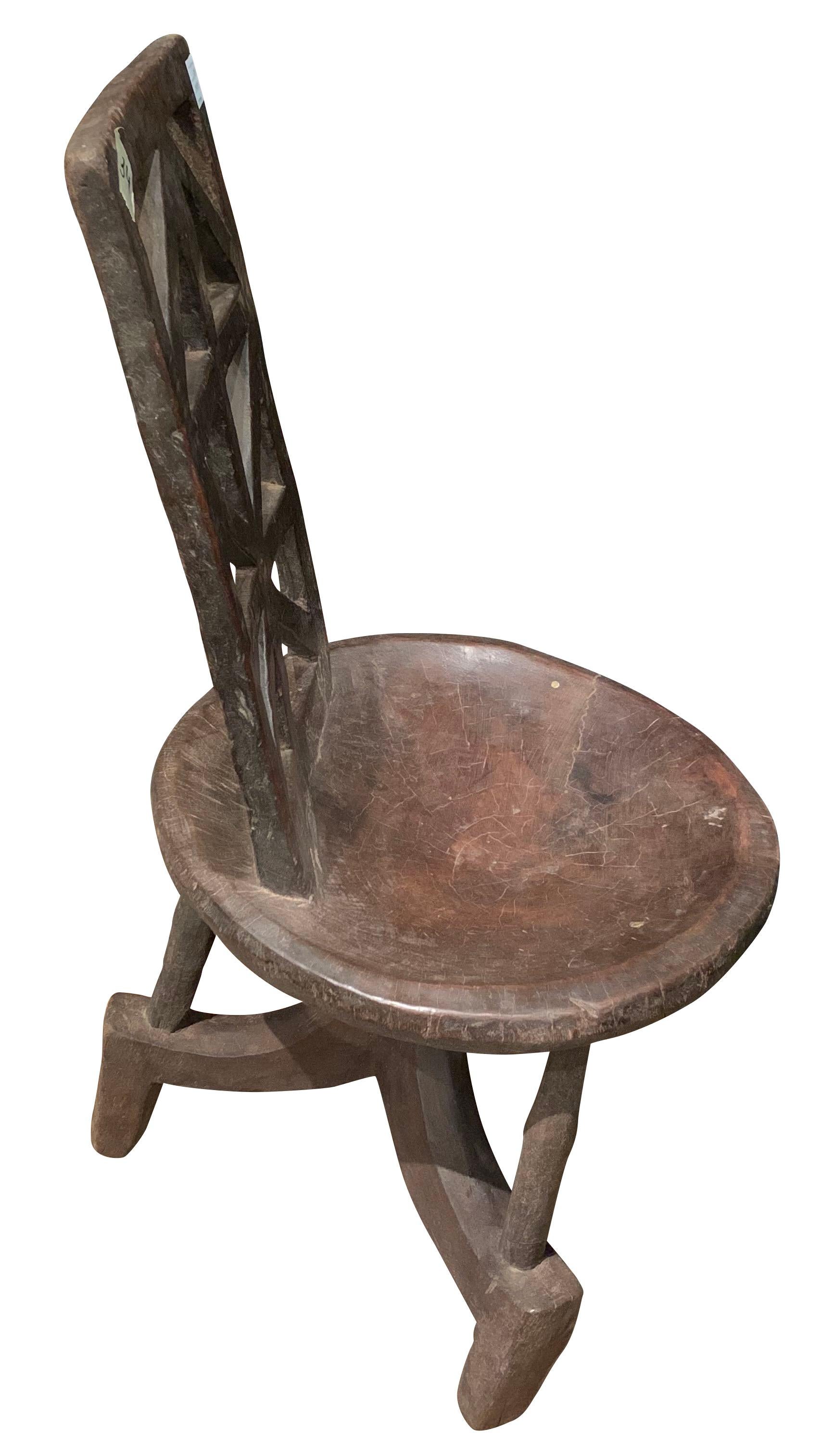 1950s traditional Ethiopian carved wood side chair
X back design
Natural dark brown color
