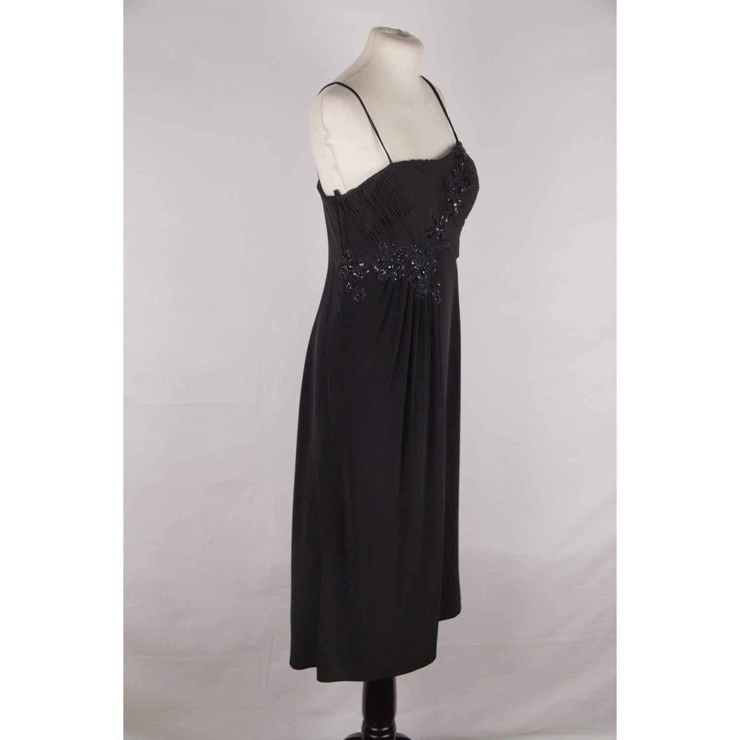 MATERIAL: Triacetate COLOR: Black MODEL: Cocktail dress GENDER: Women SIZE: Medium CONDITION RATING: B :GOOD CONDITION - Some light wear of use CONDITION DETAILS: Gently used MEASUREMENTS: SHOULDER TO SHOULDER: - BUST: 16 inches - 40,6 cm (flat -