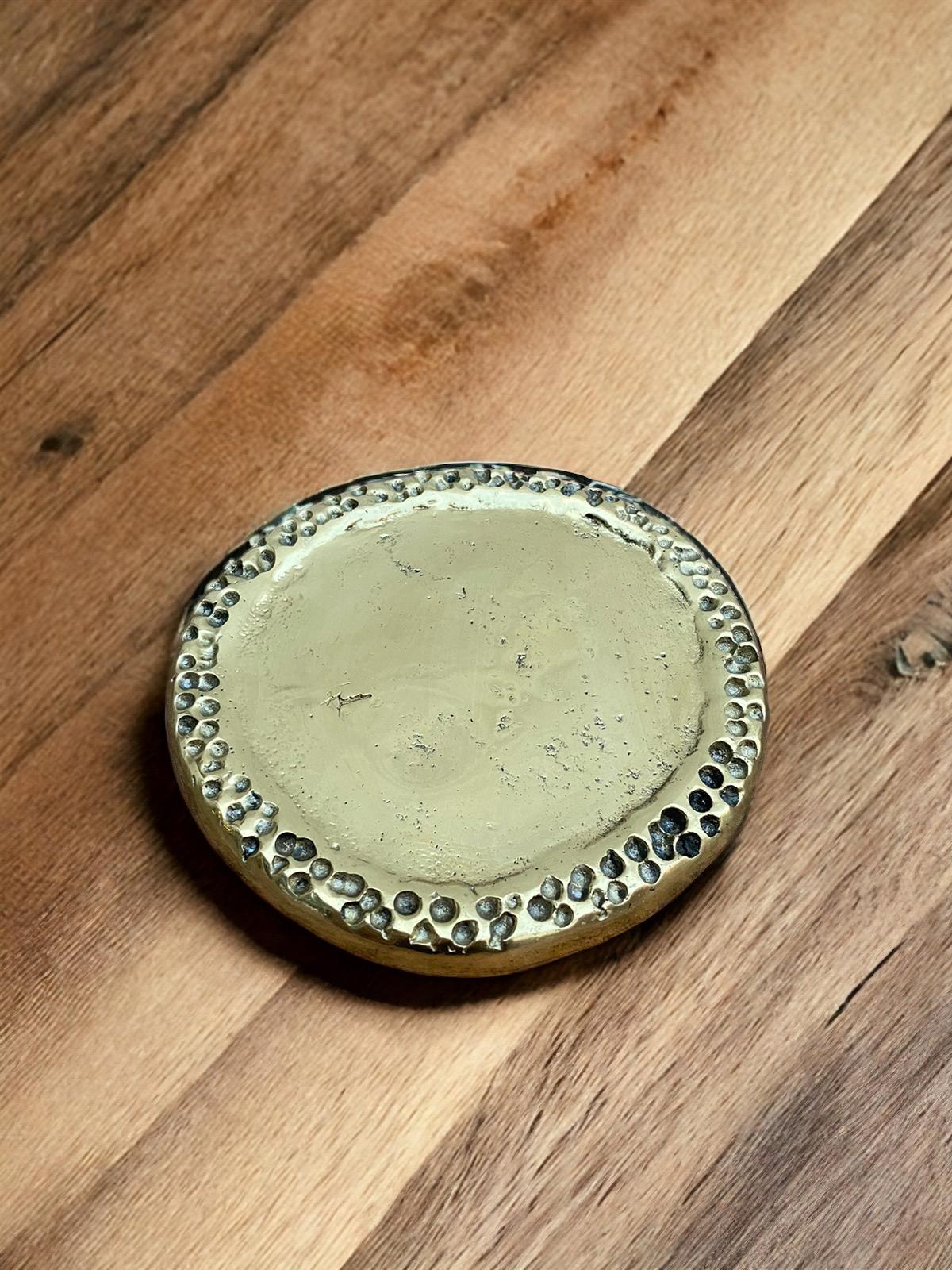 The decorative Ethnic Coaster was created by David Marshall, it is made of sand cast brass. Makes a beautiful Wedding or Company Gift.
Handmade, mounted and finished in our foundry and workshop in Spain from recycled materials.
Certified authentic