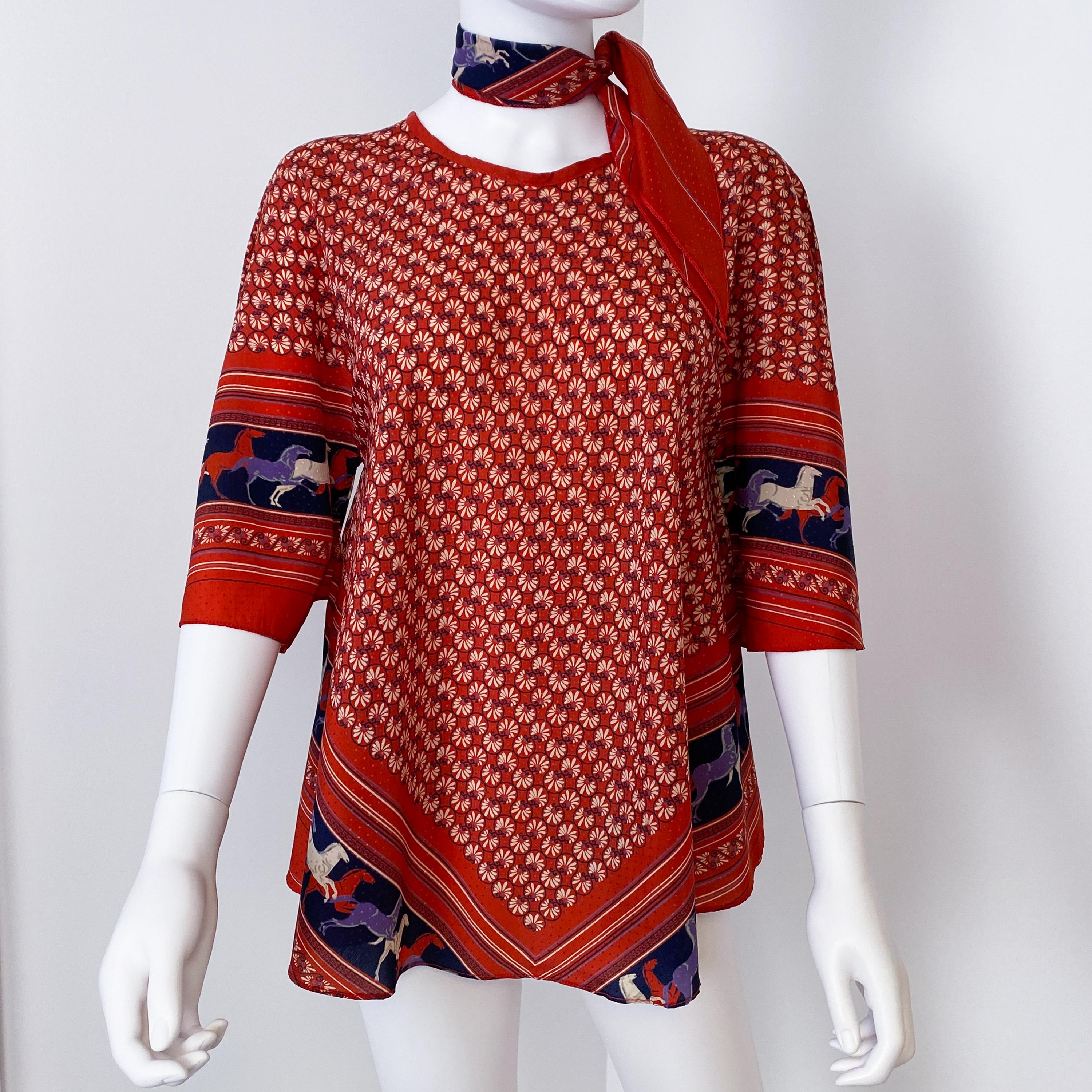 This exceptional 1970s vintage blouse tunic, crafted from satin viscose, embodies the ethnic style of the French 