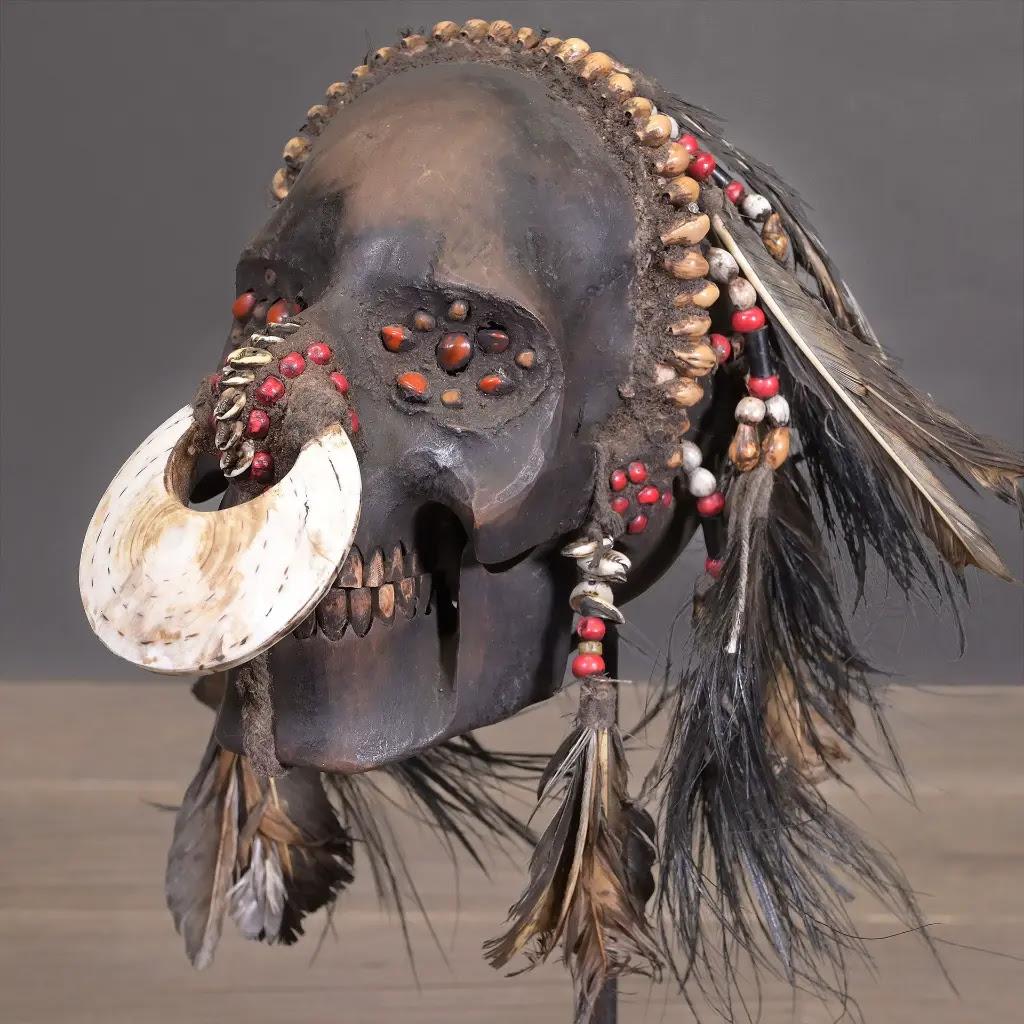 Papua New Guinean Ethnic Tribal Trophy Skull Replica in Resin, Feathers & Shells – Irian Jaya Styl For Sale