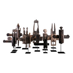 Ethnodesign collection of 12 old Dogon wooden Grannery locks fon stand from Mali